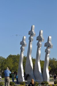 A composite flight of T-1, T-6, T-38, and T-43 aircraft fly over the Missing Man Monument at Randolph Air Force Base, TX, March 28. They are part of the fly over in support of the Freedom Flyer Reunion of former POW's. (U.S. Air Force photo by Steve White)