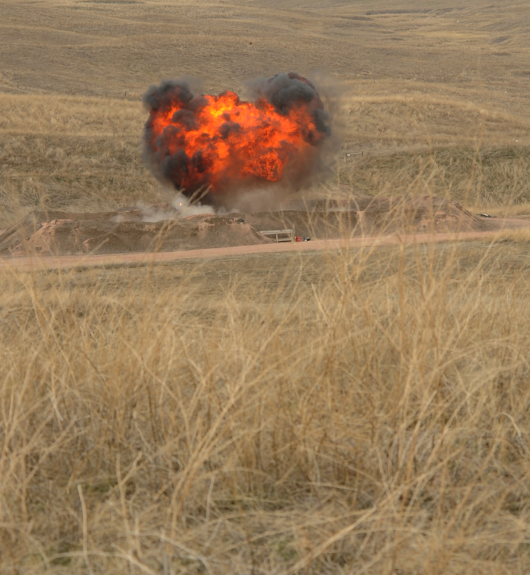 ELLSWORTH AIR FORCE BASE, S.D. — The 28th Civil Engineer Squadron explosive ordnance disposal team set a shaped charge to simulate a chemical burn, March 30. The training the EOD team is simulating will prepare them for real world scenarios. (U.S. Air Force photo/Senior Airman Adam Grant)   