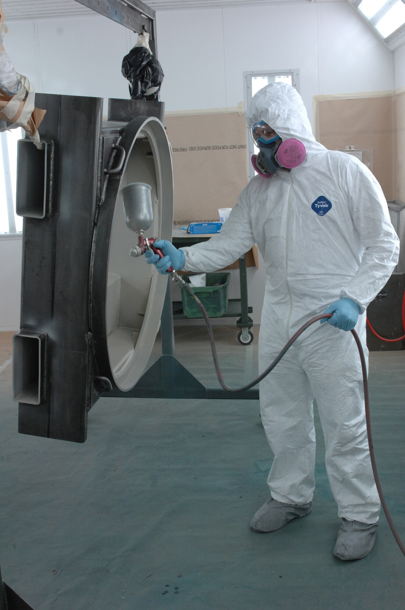 MINOT AIR FORCE BASE, N.D. -- Greg Wiggins, 91st Missile Maintenance Squadron corrosion control technician, primes material at the 91st MMXS corrosion control facility on Minot AFB March 16. Priming is part of the prepping process before parts are ready to be re-painted.  The 91st MMXS corrosion control shop maintains and helps to extend the surface life of all equipment used to support 91st Missile Wing operations.  They not only repair corrosion in-garrison, but they are also mobile and take their equipment into the field to repair corrosion at all 150 missile sites. (U.S. Air Force photo by Airman 1st Class Aaron-Forrest Wainright)