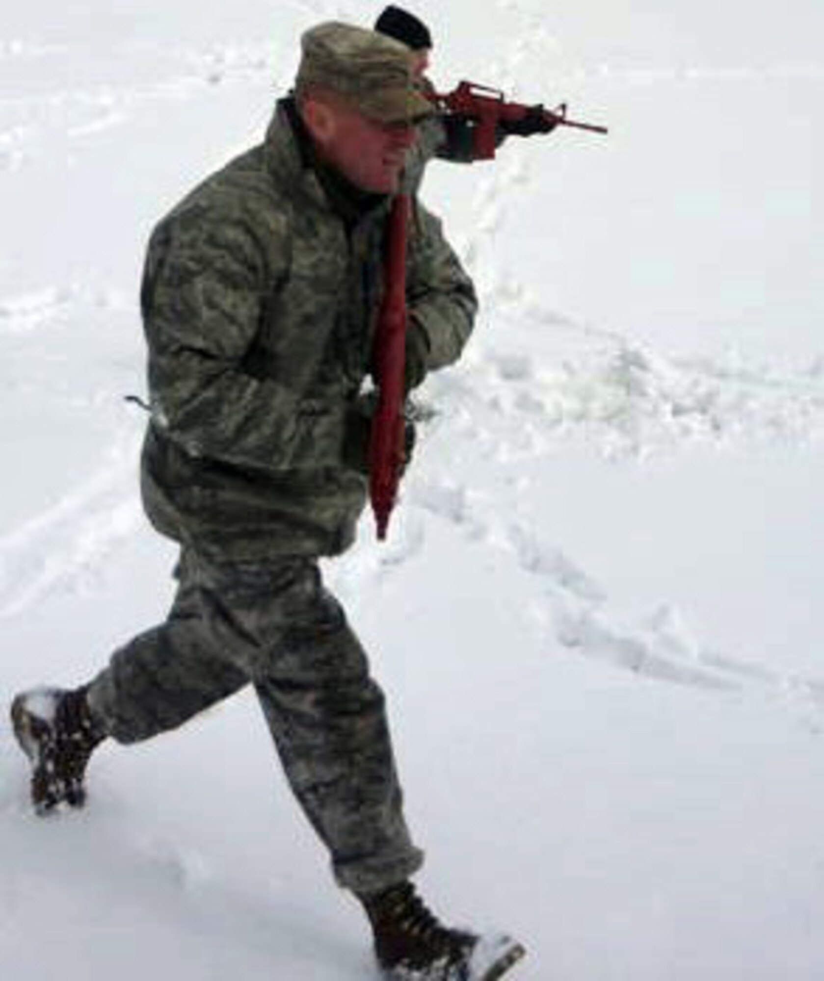 PETERSON AIR FORCE BASE, Colo. -- Master Sgt. Frank Green, 21st Security Forces Squadron Guardian Challenge team leader, participates in a bounding over-watch action and battle drill, March 24 at Patriot Park in preparation for 2010 Guardian Challenge competition. Every two years Air Force Space Command hosts Guardian Challenge, the premier space and cyberspace competition in the world. (Courtesy photo)