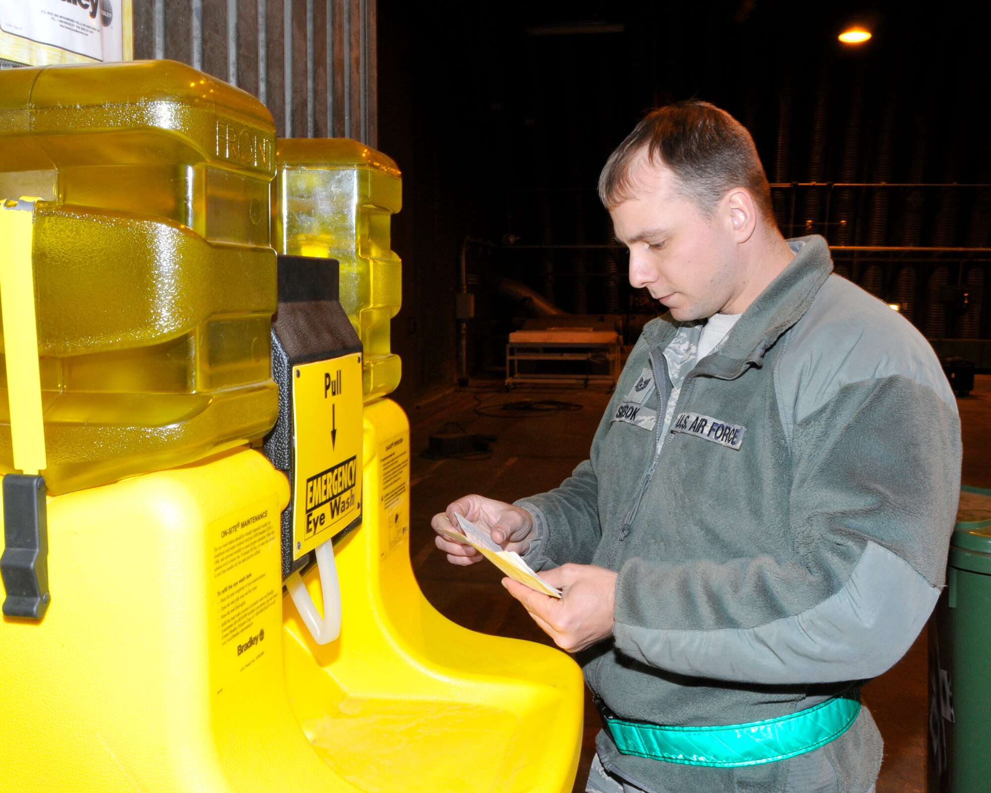 Tech. Sgt. Martin Sebok, 56th Helicopter Maintenance Unit HH-60G Flightline Expediter, performs a quality check on a wash station inside an aircraft hangar at RAF Lakenheath March. 30. Sgt. Sebok was nominated for a Liberty Spotlight because he portrays 'Service Before Self'. (U.S. Air Force photo/Airman 1st Class Eboni Knox)