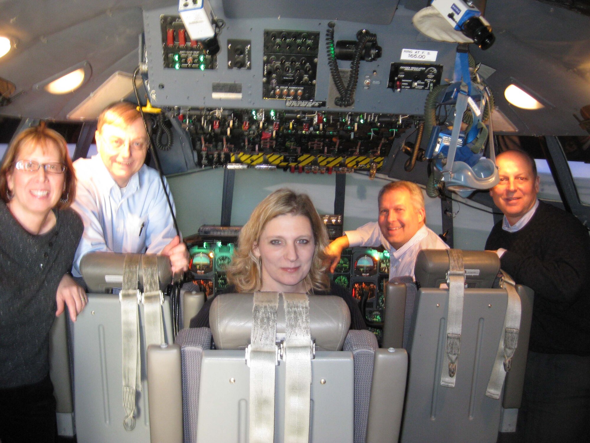 As part of her First Sergeant of the Year award, Senior Master Sgt. Vicky Kuntz (left) was able to bring in her civilian employers to take a flight in the C-130 flight simulator on base.  From left are General Mills Information Systems leaders Mike Meinz, Michelle Rademacher, 
Mike Martiny and  Mike Kirst. (Courtesy photo)

