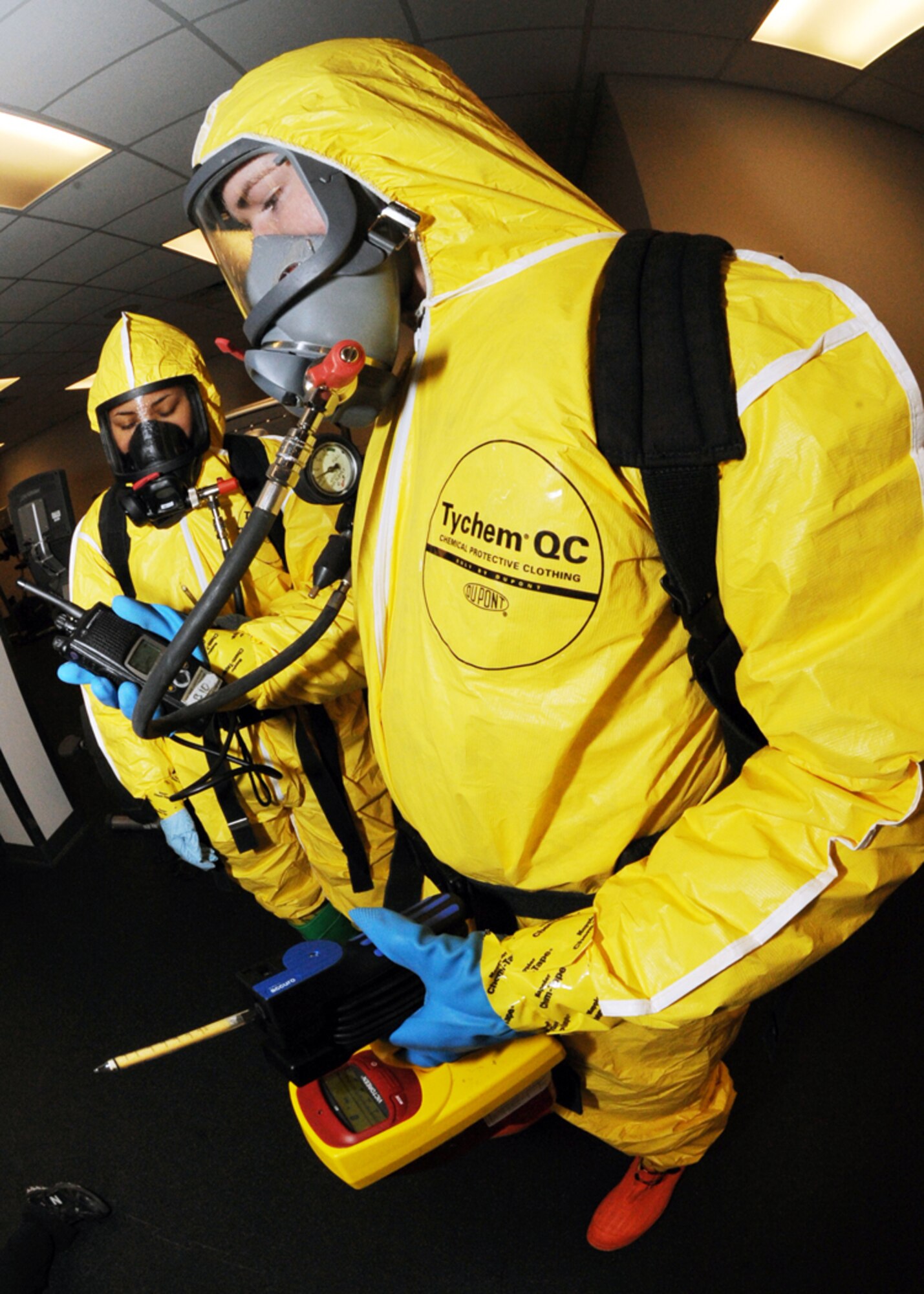 MINOT AIR FORCE BASE, N.D. – Senior Airman Jimmy VanHuss and Airman 1st Class Anjelika Rodriguez, both 5th Medical Operations Squadron bioenvironmental engineering technicians, use Drager Tubes to detect chemicals in a contaminated area during the major accident response exercise at Minot AFB March 26. Exercises like this provide the installation commander a way to conduct realistic exercises for all installation personnel. (U.S. Air Force photo by Senior Airman Sharida Jackson)
