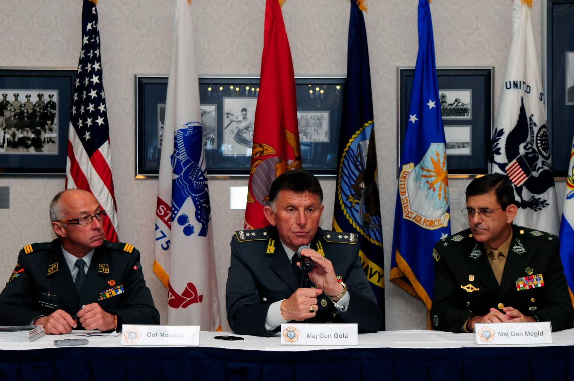 Members of the Conseil International du Sport  Militaire board of directors answer questions March 28 during a press conference at the Bolling Club. CISM was founded Feb. 18, 1948 with Belgium, Denmark, France and Luxembourg and the Netherlands representatives signing the original charter. Many organizations from Bolling supported the week-long conference that involved leaders representing 17 countries.  (U.S. Air Force photo by Staff Sgt. Raymond Mills)
