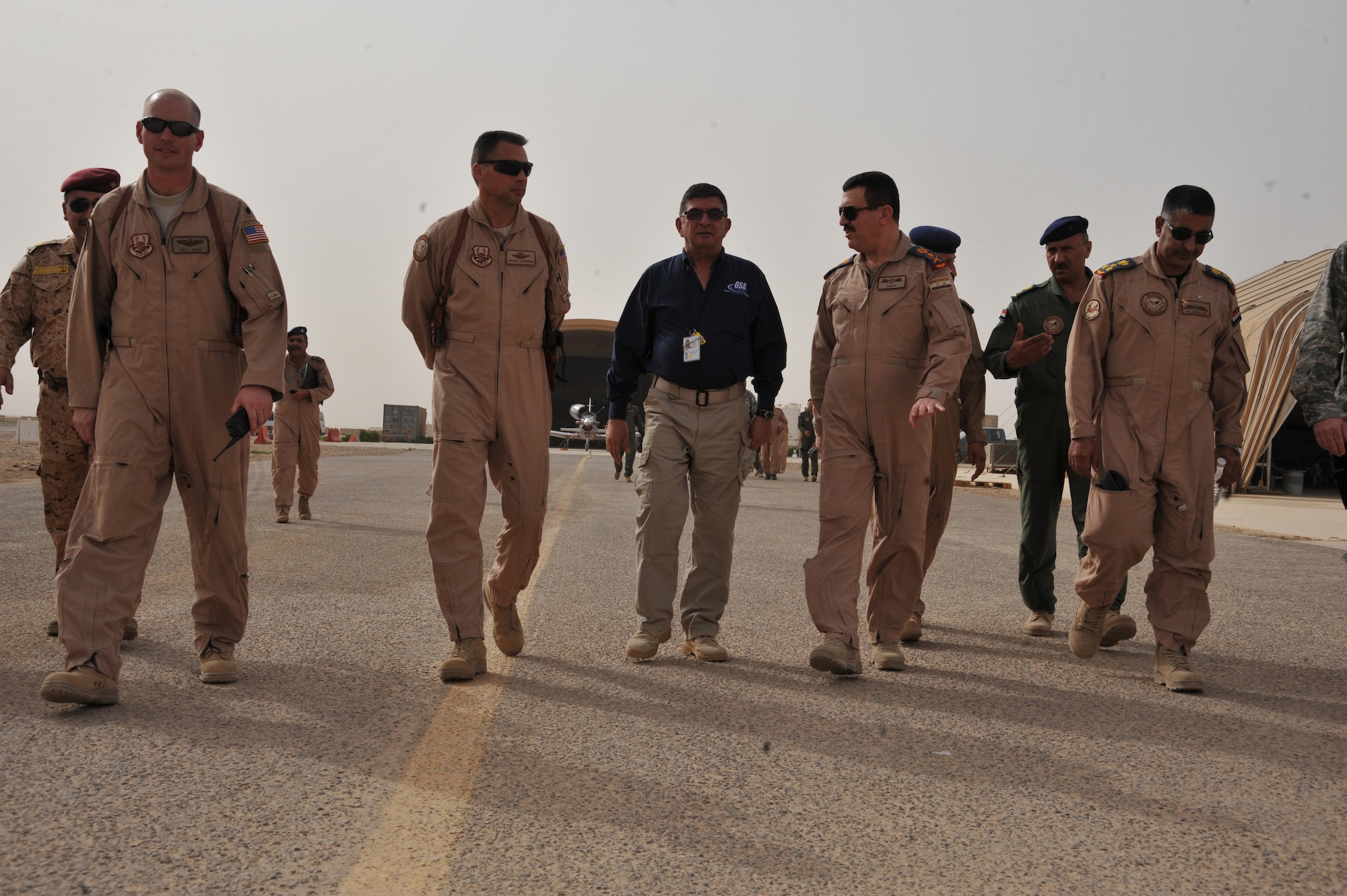U.S. Air Force Brig. Gen. Scott Hanson, commander of the 321st Air Expeditionary Wing and the Iraq Training and Advisory Mission-Air Force, and Iraqi air force Commander Gen. Lt. Gen. Anwar Hamad Amen Ahmed  prepare to leave the 52nd Expeditionary Flying Training Squadron at Combat Operations Base Speicher, Iraq, March 11, 2010. (U.S. Air Force photo/ Staff Sgt. Quinton Russ/Released)