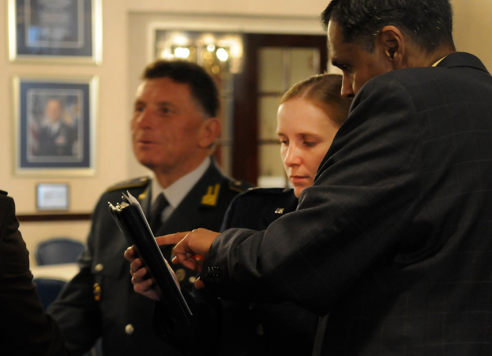 Capt. Michelle Bottoms, Air Force District of Washington Protocol, helps coordinate the Conseil International du Sport Militaire event March 28 at the Bolling Club. CISM was founded Feb. 18, 1948 with Belgium, Denmark, France and Luxembourg and the Netherlands representatives signing the original charter. Many organizations from Bolling supported the week-long conference that involved leaders representing 17 countries. (U.S. Air Force photo by Senior Airman Alexandre Montes)