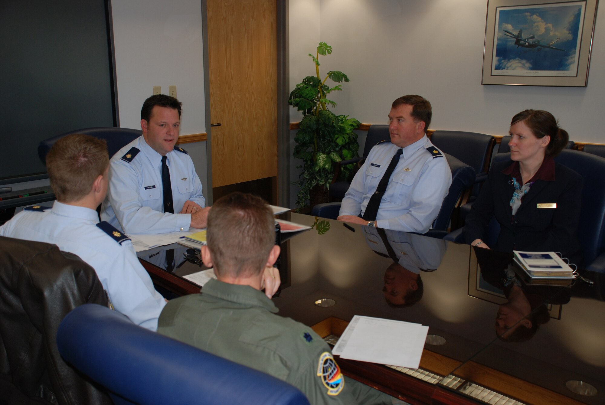 Pilots and flight attendants meet several hours before takeoff to discuss safety and goals of another important flying mission at the 932nd Airlift Wing.  (U.S. Air Force photo/Maj. Stan Paregien)