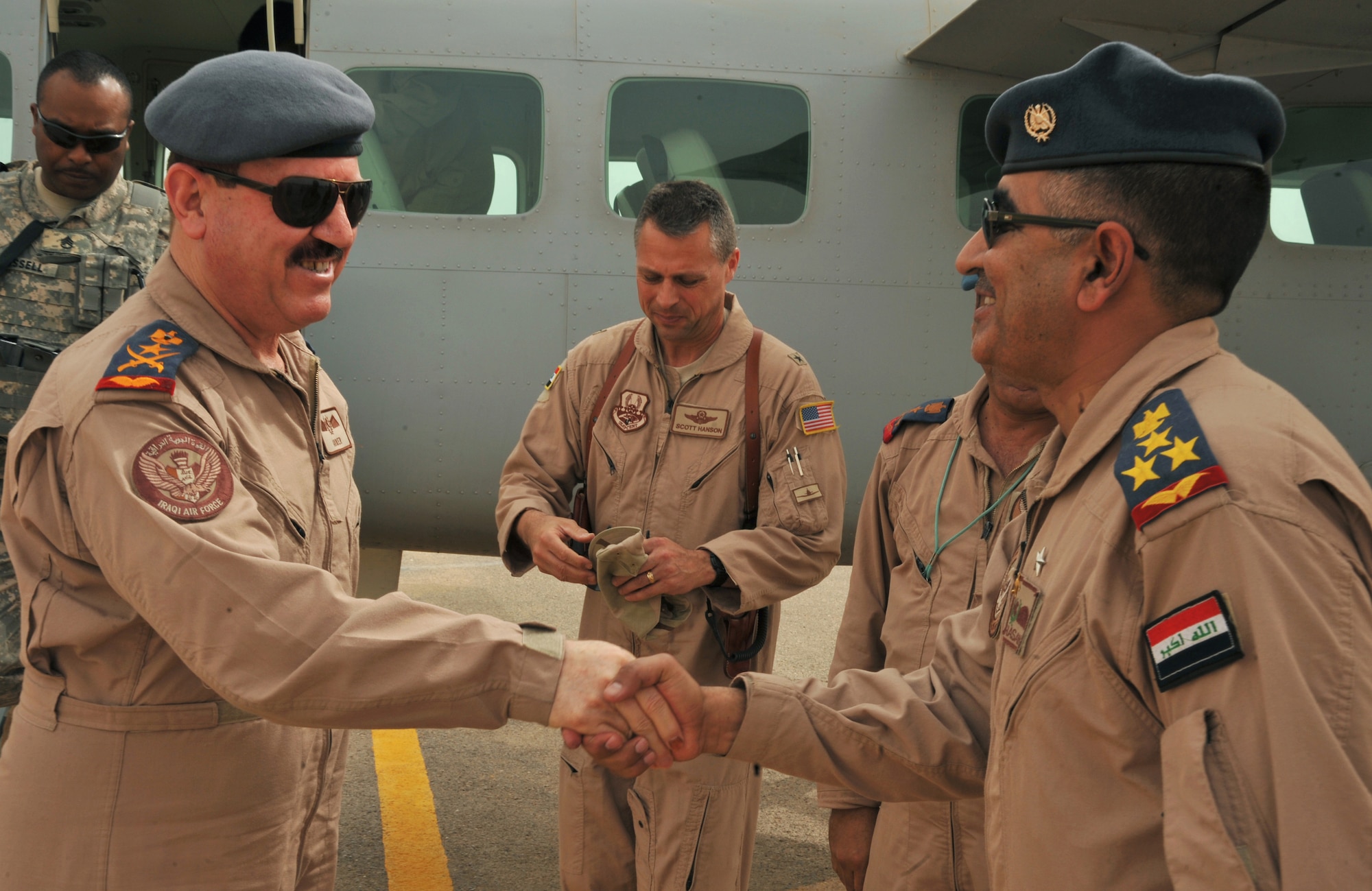 Iraqi Air Force Lt. Gen. Anwar Hamad Amen Ahmed, left, shakes hands with an Iraqi Air Force officer upon his arrival at Combat Operating Base Speicher, Iraq, March 11, 2010.  General Anwar is the commander of the Iraqi Air Force. (U.S. Air Force photo/ Staff Sgt. Quinton Russ/Released)