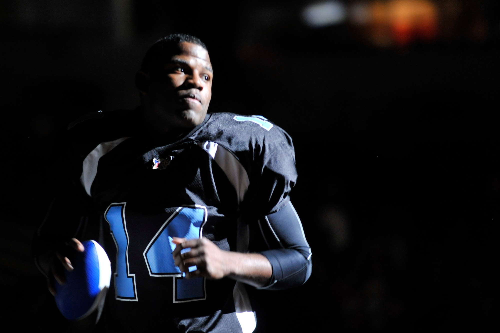 Vickiel Vaughn, No. 14 of the Arkansas Diamonds, prepares to enter the field March 27 at Verizon Arena. The Arkansas Diamonds battled the Abilene Ruff Riders for Military Appreciation Night. (U.S. Air Force photo by Senior Airman Christine Clark)