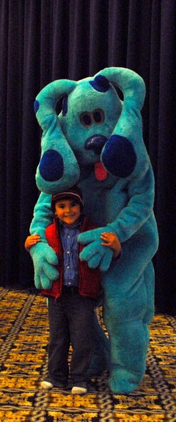 Oswaldo Gonzalez, 4, son of Staff Sgt. Edwin Gonzalez, 436th Logistic Readiness Squadron, poses with Blue from Blue's Clues during a Family Night Event at the Landings March 26. The event ran from 5:30 - 7:30 p.m. and had food, crafts and other entertainment. (U.S. Air Force photo/Airman 1st Class Matthew Hubby)