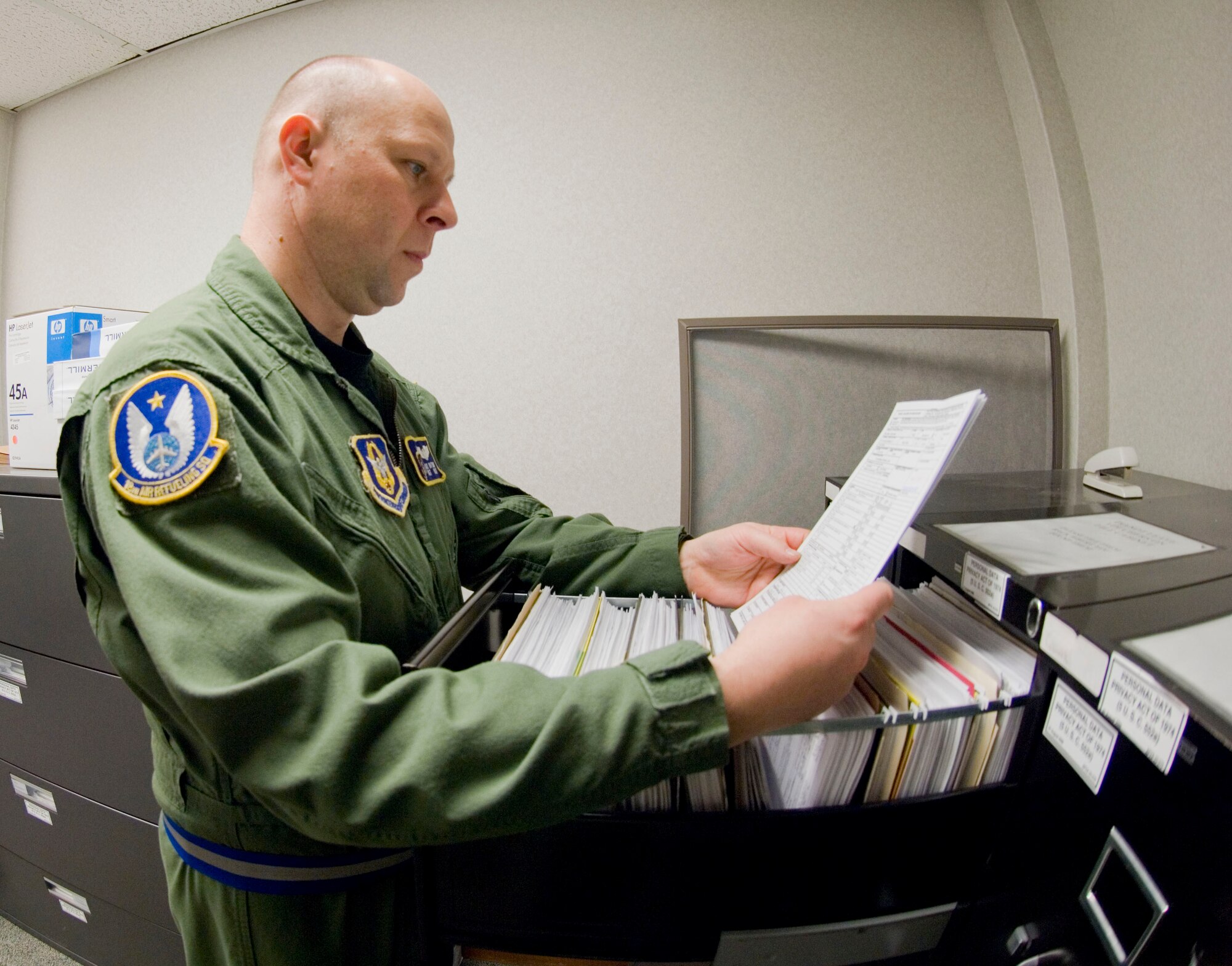 Tech. Sgt. Clay Dotson, 22nd Comptroller Squadron reserve travel voucher reviewer/18th Air Refueling Squadron KC-135R boom operator, reviews travel vouchers for accuracy.  In addition to reviewing travel vouchers, the Wichita, Kan., native performs in-flight refueling missions for the 18th Air Refueling Squadron. (U.S. Air Force photo/Senior Airman Abigail Klein) 