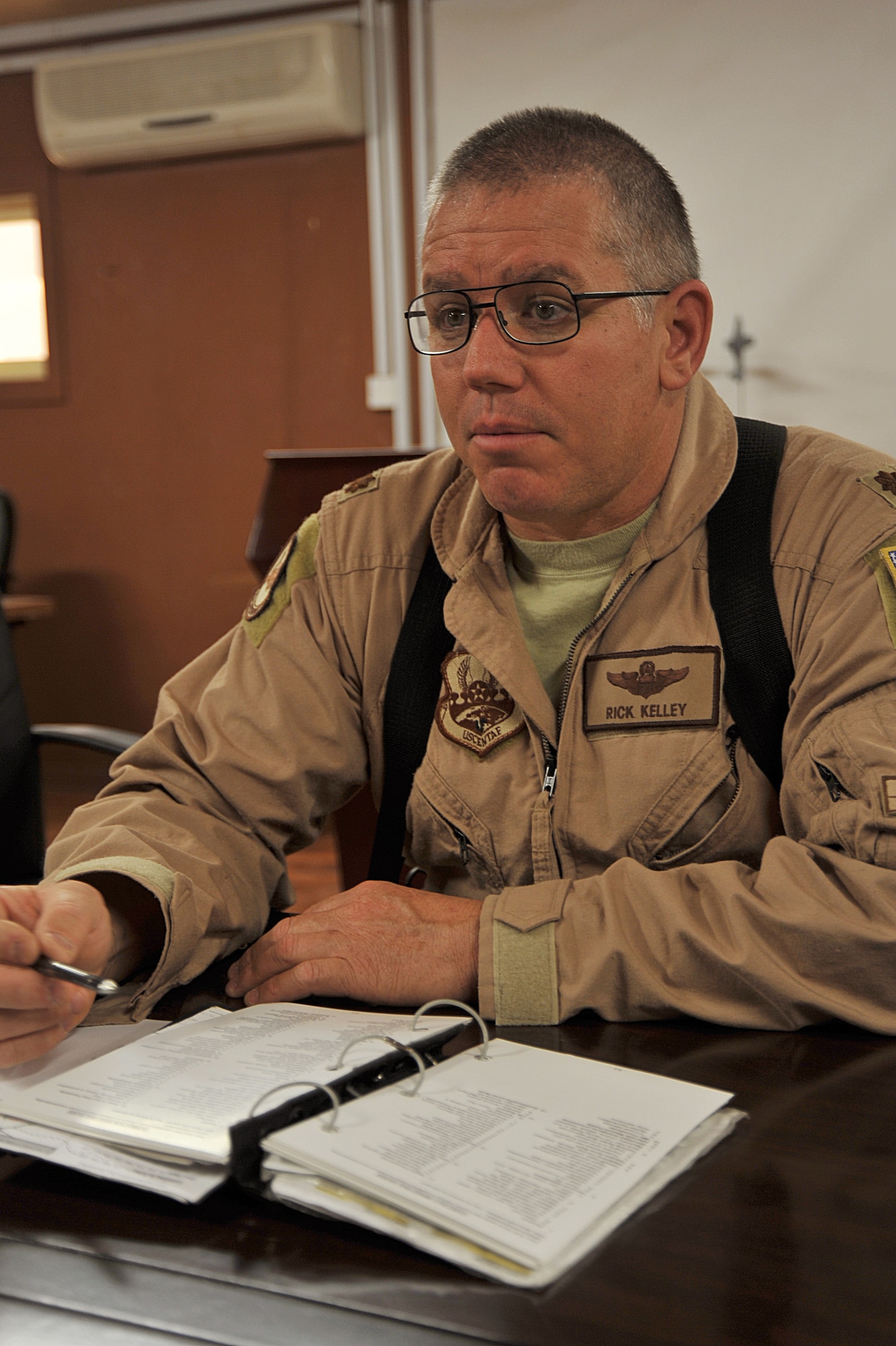U.S. Air Force pilot Maj. Rick Kelley briefs training scenarios for flight students before a T-6 training flight from Combat Operations Base Speicher, Iraq, March 15, 2010.  Maj. Kelley is an instructor pilot training the Iraqi Air Force and deployed from the 559th Flying Training Squadron, Randolph AFB, TX.  This inaugural class will generate the initial cadre of Iraqi Air Force T-6 instructor pilots. (U.S. Air Force photo by/Staff Sgt Quinton Russ/released)