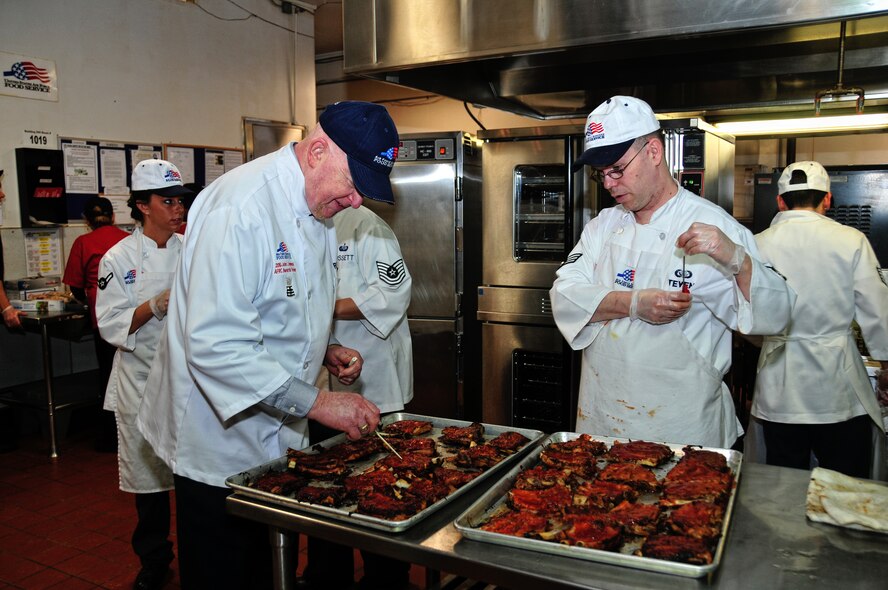 Art Ritt observing members of the 914th Services Squadron, preparing the days lunch, February 6, 2010, Niagara Falls Air Reserve Station, NY. Mr. Ritt is one of the judges determining which base will win the John L. Hennessy Award. (U.S Air Force Photo by Staff Sgt. Joseph McKee)