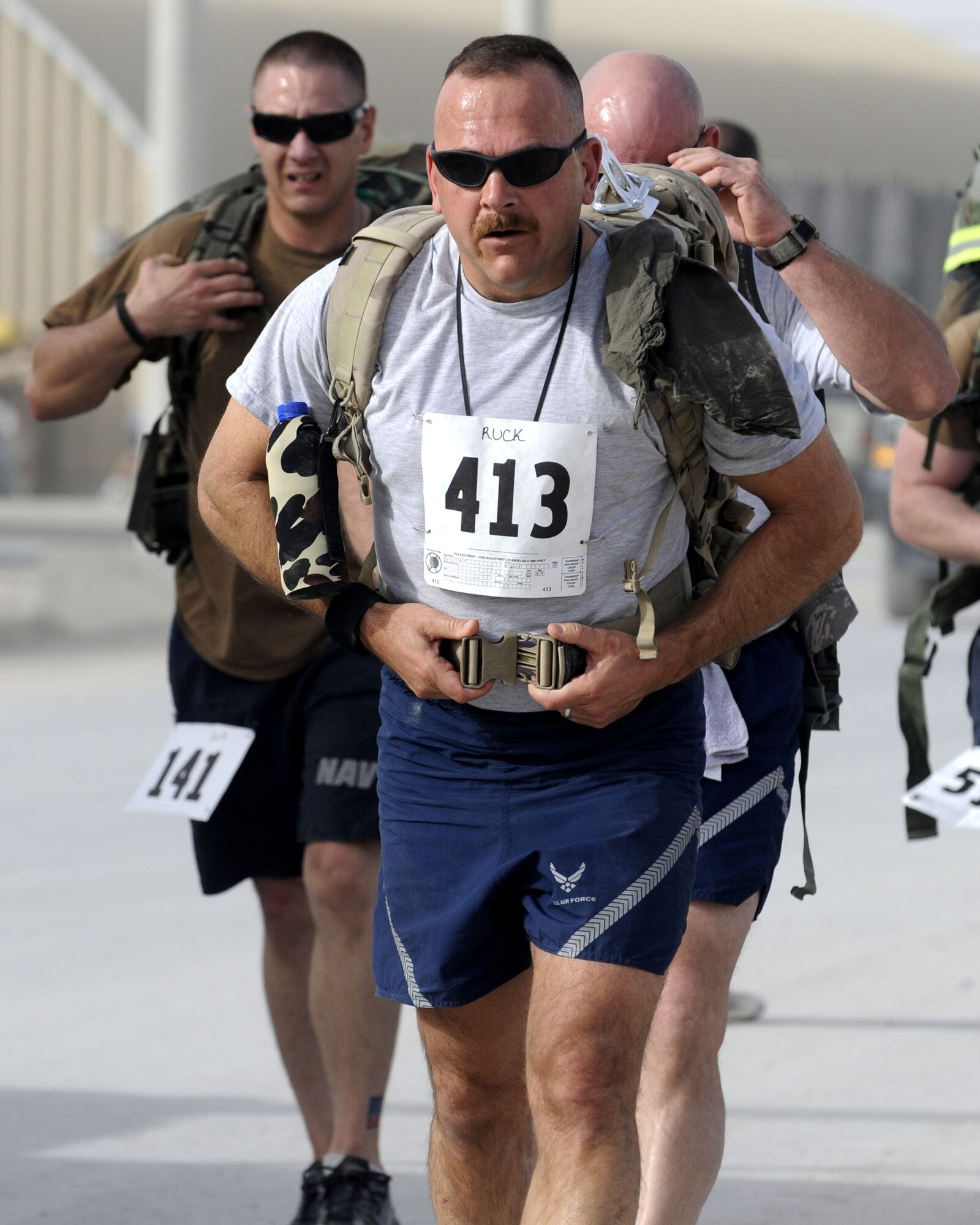 Members chose one of three ways to participate: a five kilometer run, a 10-kilometer run or a biathlon, a 5K run followed by another  5K run with a 35-pound ruck sack strapped to their backs.  (U.S. Air Force photos by Senior Airman Nancy Hooks/Released)
