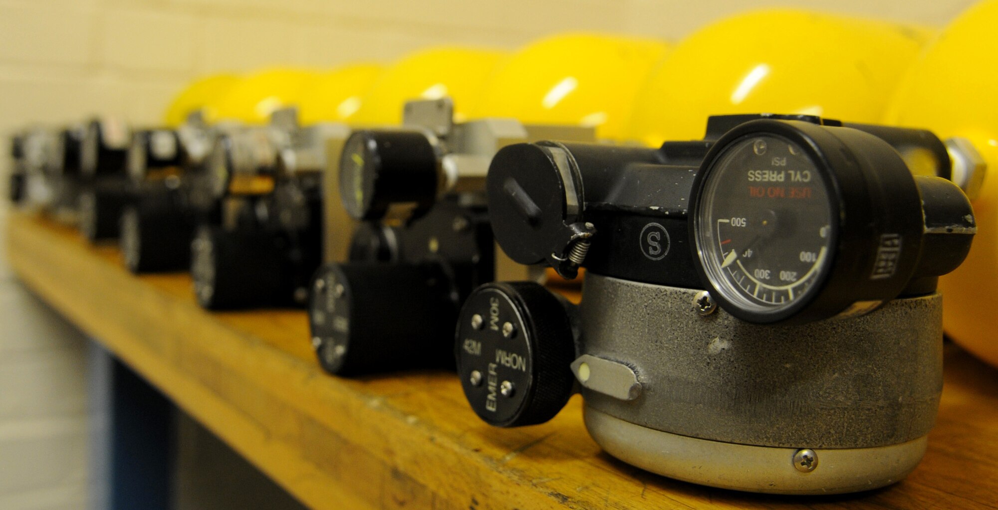 RAF MILDENHALL, England – A row of portable oxygen cylinders sit after servicing is completed at the electrical and environmental back shop March 30. (U.S. Air Force photo/ Staff Sgt. Jerry Fleshman)