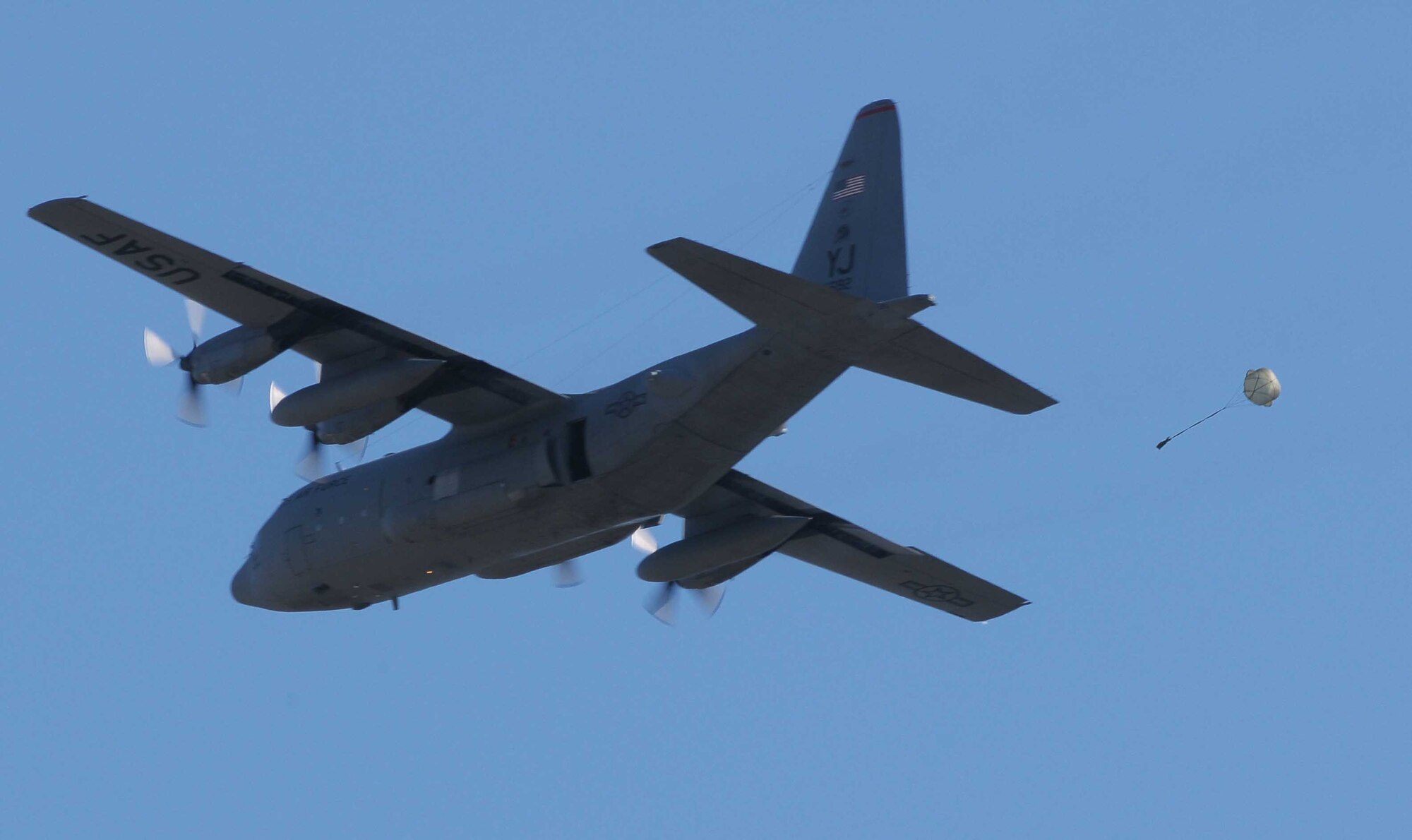 YOKOTA AIR BASE, Japan -- A C-130H Hercules practices an air drop  during a seven- aircraft formation launch exercise Mar. 30. (U.S. Air Force photo/Airman 1st Class Devin Doskey)