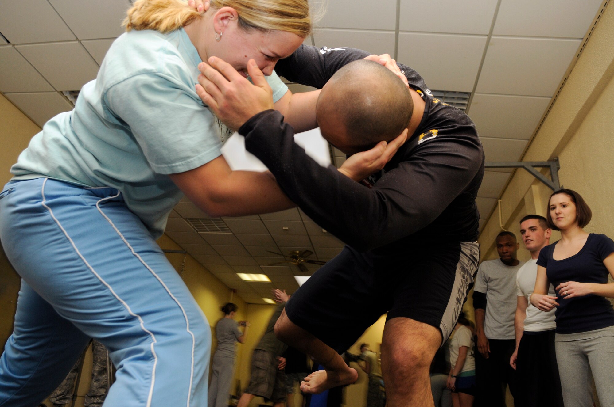 SPANGDAHLEM AIR BASE, Germany – Schawann McGee, wife of Capt. Barry McGee, 52nd Operations Support Squadron, throws Jesus Carlos, husband of Staff Sgt. Leonor Carlos, 52nd Medical Operations Squadron, to the ground during a self-defense course at Skelton Memorial Fitness Center March 26. This class was among many events focused on preventing sexual assault during Sexual Assault Awareness Month. (U.S. Air Force photo/Senior Airman Benjamin Wilson)