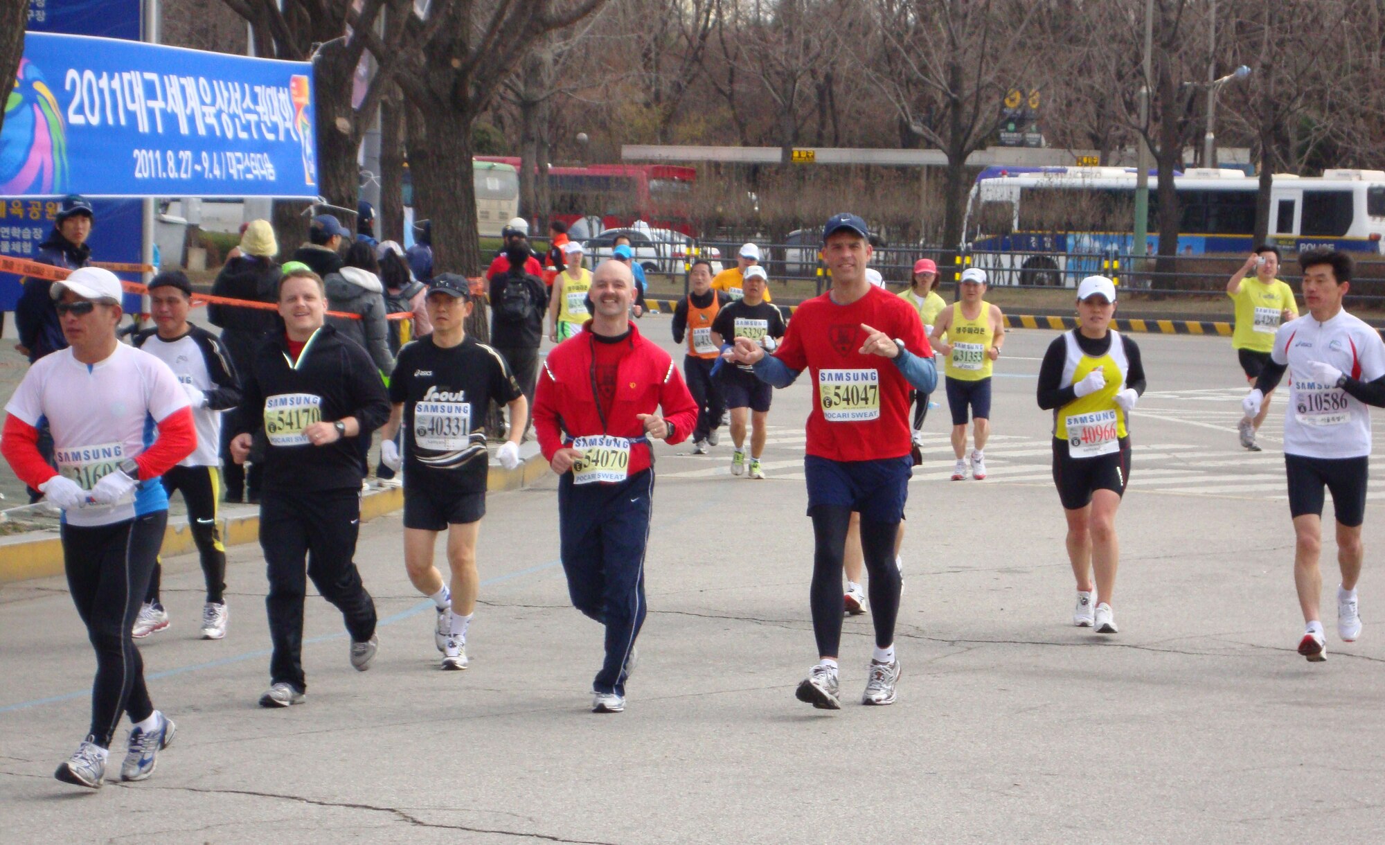 Two team members from the Fiends for Knights run in the Seoul International Marathon March 21. The team is compiled of fourteen members from Osan Air Base, Republic of Korea. (Courtesy photo)