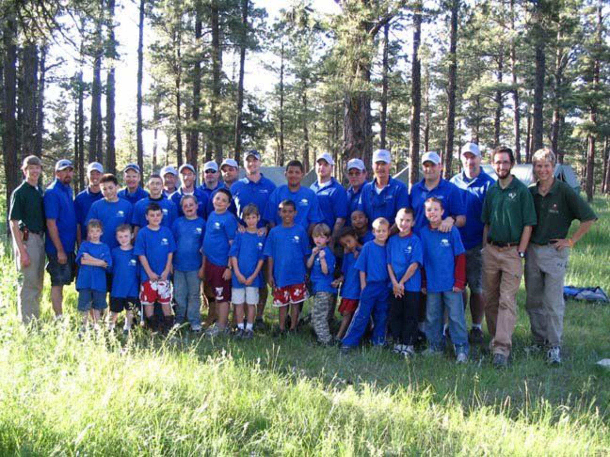 Boys stand with group leaders and mentors at Knights of Heroes summer camp in 2007. (Courtesy photo)