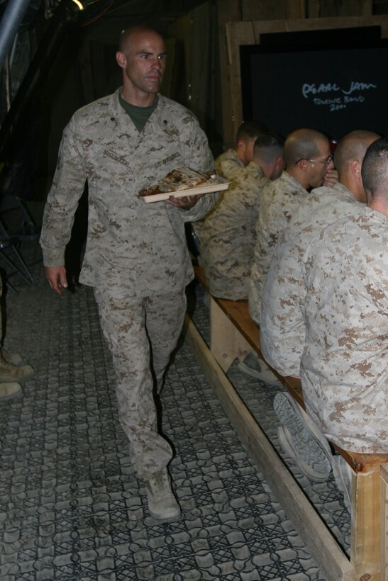 Lt. Col. John E. McDonough, the commanding officer of 2nd Battalion, 2nd Marine Regiment, serves food to Marines and local Afghan leaders during a dinner on Forward Operating Base Delhi, Garmsir District, Helmand province, Afghanistan, May 1. The dinner was held as a time to begin to establish a strong relationship between 3rd Battalion, 1st Marine Regiment, and Afghan national security forces similar to the one that 2/2 and ANSF had.