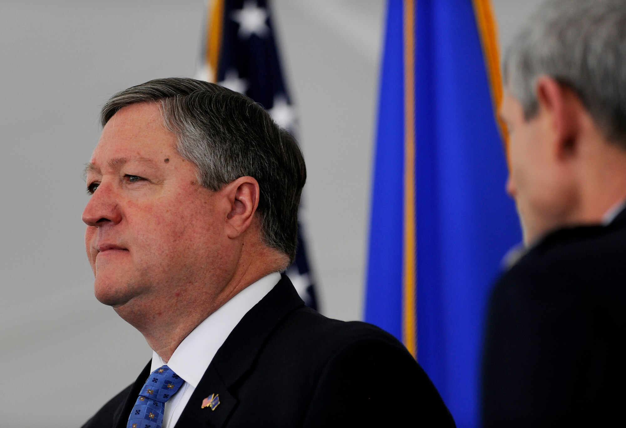 Secretary of the Air Force Michael B. Donley and Air Force Chief of Staff Gen. Norton Schwartz stand in ceremony May 1 while the national anthem plays during a groundbreaking ceremony for the future Fisher House at Dover Air Force Base, Del. The Secretary co-hosted the ceremony with General Schwartz and Kenneth Fisher, the Fisher House Foundation chairman of the board of trustees . This Fisher House is unique in that it will provide hospice services to family members awaiting the return of their fallen servicemembers from overseas. (U.S. Air Force photo/Scott M. Ash) 