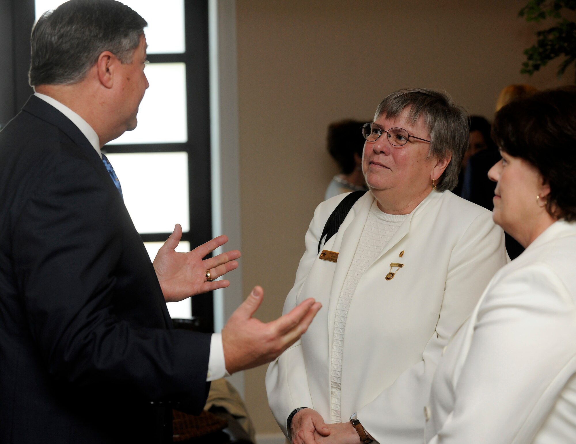 Secretary of the Air Force Michael B. Donley speaks to members of the Gold Star Mothers of America, including their National President, Ruth Stonesipher, center, May 1 at Dover Air Force Base, Del. The Secretary, Gen. Norton A. Schwartz, Air Force Chief of Staff and other senior leaders were at Dover to co-host a groundbreaking ceremony for a new Fisher House there. This Fisher House is the first to be built and dedicated to provide hospice services to family members of fallen servicemembers.  (U.S. Air Force photo/Scott M. Ash) 