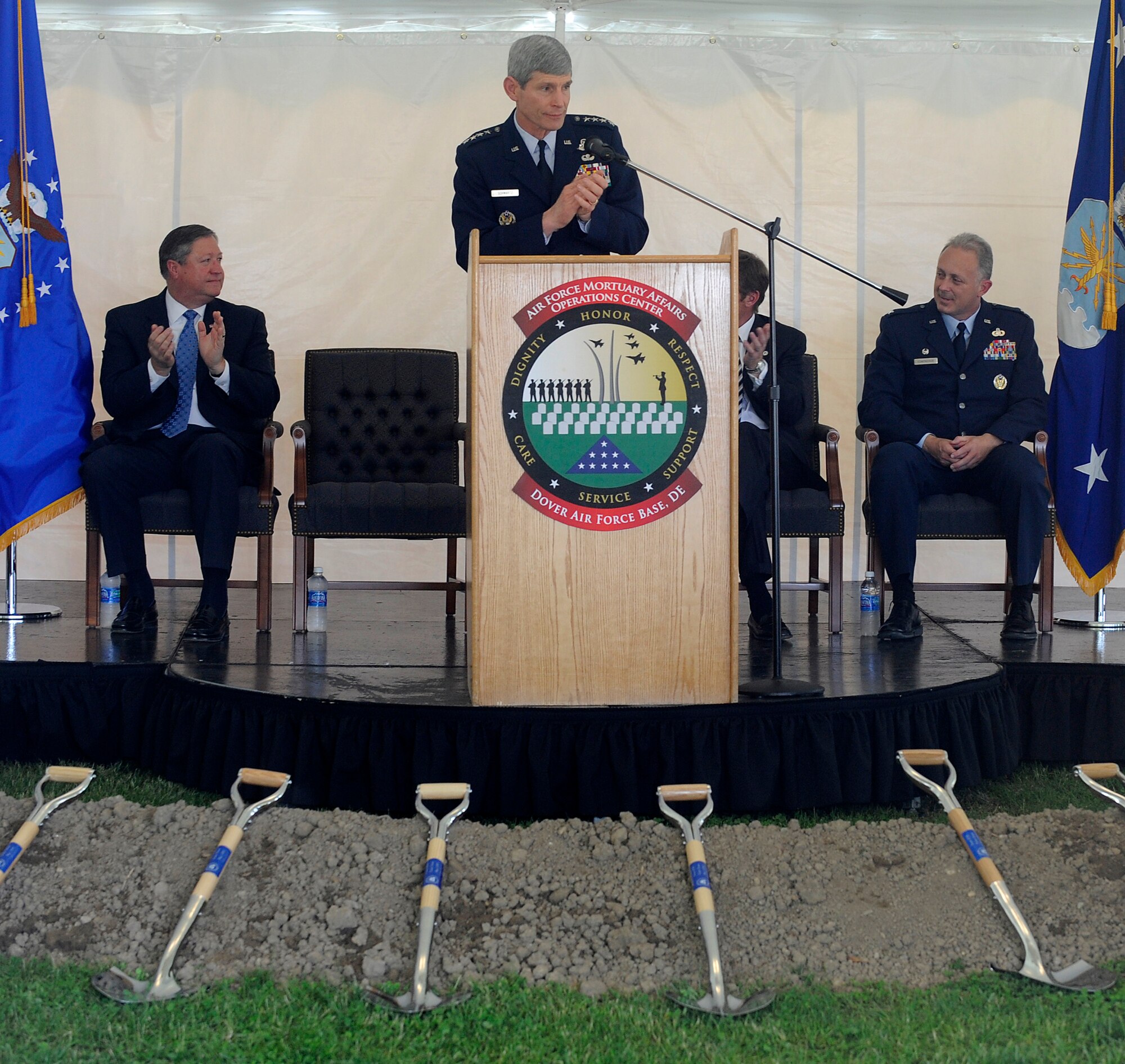 Gen. Norton Schwartz, Air Force Chief of Staff, applauds members of the Gold Star Mothers of America, who were in attendance during the groundbreaking ceremony of the Fisher House at Dover Air Force Base, Del., May 1. From left are Secretary of the Air Force Michael B. Donley and Col. Robert Edmondson, commander of the Air Force Mortuary Affairs Operations Center, which provides comfort for those awaiting the return of their fallen family members from overseas. (U.S. Air Force photo/Scott M. Ash) 