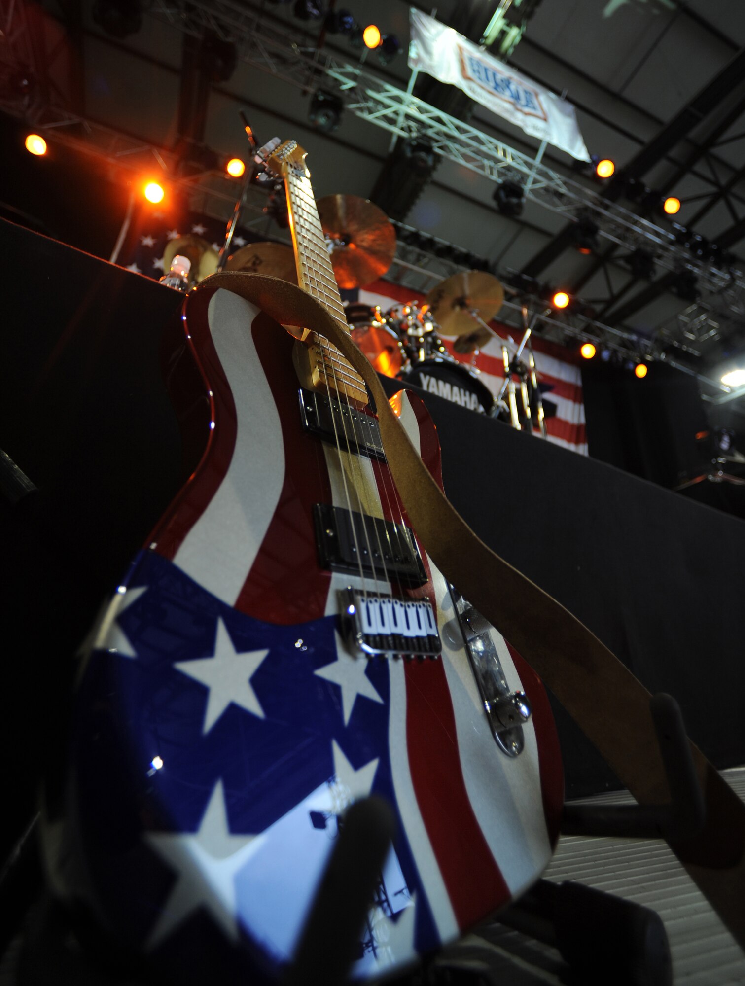 An electric guitar rests on a stand prior to the Toby Keith Concert, Ramstein Air Base, Germany, May, 1, 2010. The Toby Keith concert, sponsored by the United Services Organization and Armed Forces Entertainment, was designed to entertain and help boost the morale of troops and their families. Toby Keith will be making stops throughout Germany, Korea and the Persian Gulf during his 14-day country tour. (U.S. Air Force Photo by Airman 1st Class Caleb Pierce)