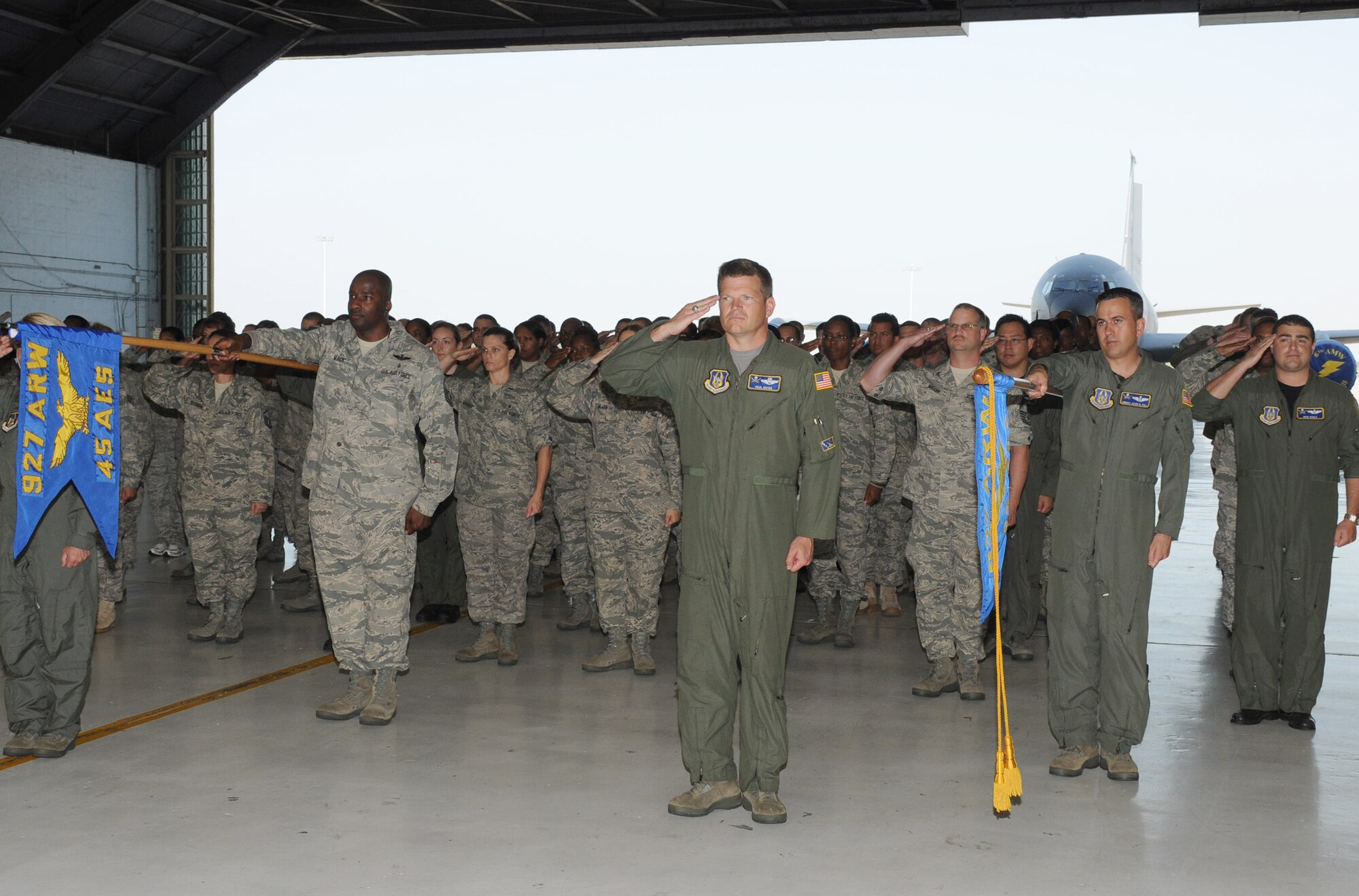 Members of the 927th Operations Group salute their new commander, Col. Thomas Pemberton, for the first time at a change of command ceremony at MacDill Air Force Base, Fla., May 1, 2010. The group also bid farewell to their former commander, Col. Douglas Schwartz, with a final salute during the ceremony in Hangar 3. (U.S. Air Force photo by Senior Airman Anna-Marie Wyant)