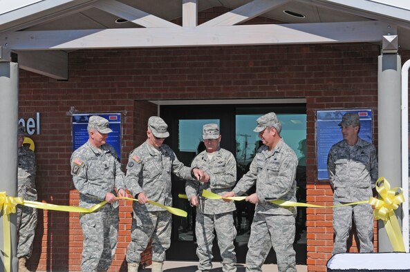 Brig. Gen. Gary Sayler Commanding General for the Idaho National Guard cuts the ribbon for the opening of the Joint Forces Personnel Readiness Center and signing of the Idaho National Guard and Reserves Family Covenant at Gowen Field Sunday. The center will serve as a one-stop shop for Idaho service members of all branches and their families preparing for deployment, during and post deployment.

“We have made great strides in the last few years with General Lafrenz as a driving force and his vision of helping soldiers, airman, sailors and marines,” said Brig. Gen. Sayler.    

The covenant outlines a commitment to improve family readiness with a focus on existing family programs and services, healthcare, education, youth services, childcare and employment. (Air Force photo by Staff Sgt. Heather Walsh)


