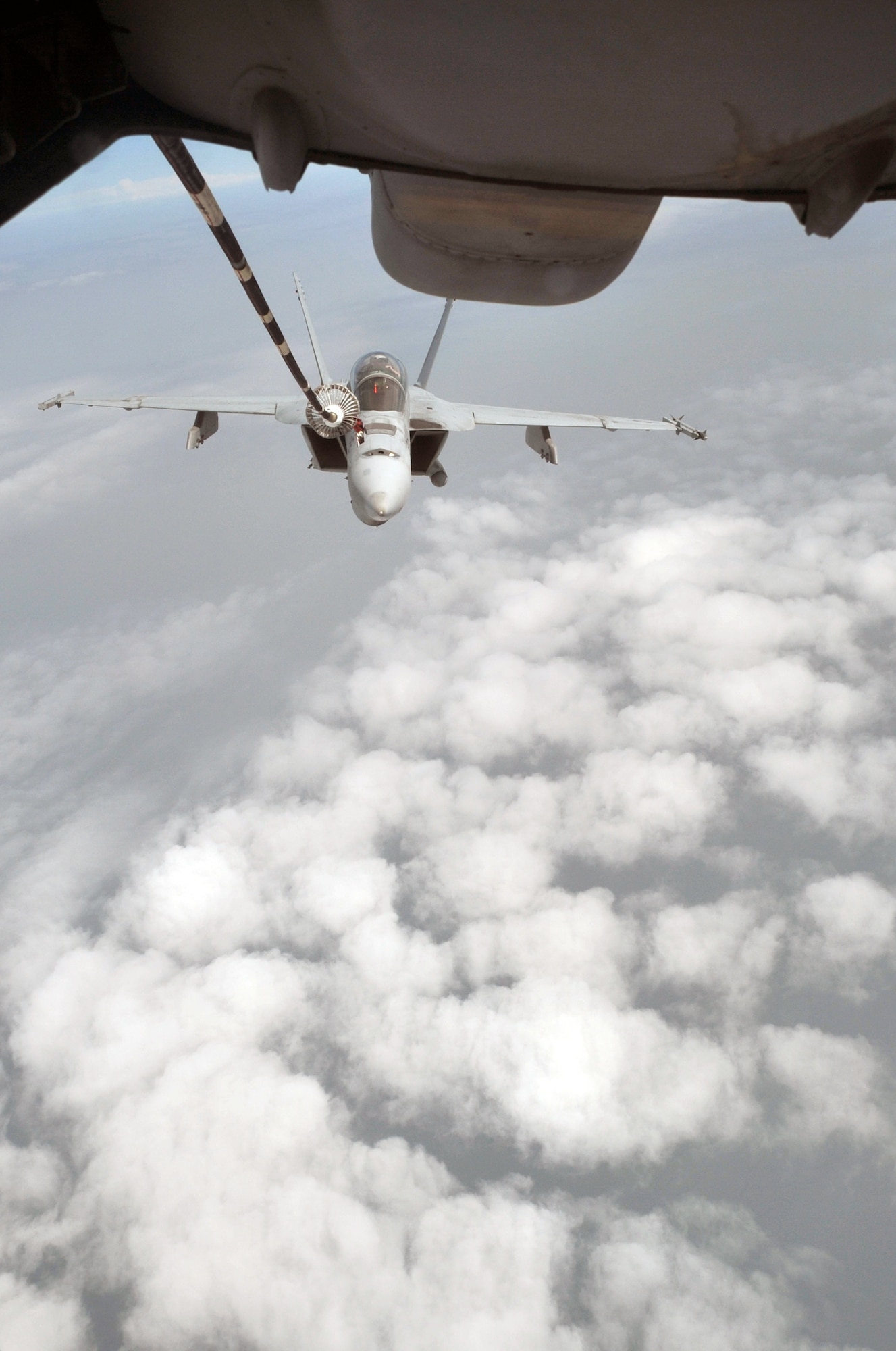A U.S. Navy F-18 is refueled by a KC-10 Extender from the 908th Expeditionary Air Refueling Squadron during an air refueling mission in the U.S. Central Command area of responsibility on April 24, 2010. In the first three months of 2010, Airmen supporting the KC-10 deployed air refueling in the U.S. Central Command area of responsibility flew more than 1,000 sorties offl-loading more than 108 million pounds of fuel to more than 6,600 aircraft in support of combat operations. The 908th EARS, as part of the 380th Air Expeditionary Wing, supports operations Iraqi Freedom and Enduring Freedom and the Combined Joint Task Force-Horn of Africa. (U.S. Air Force Photo/Master Sgt. Scott T. Sturkol/Released)
