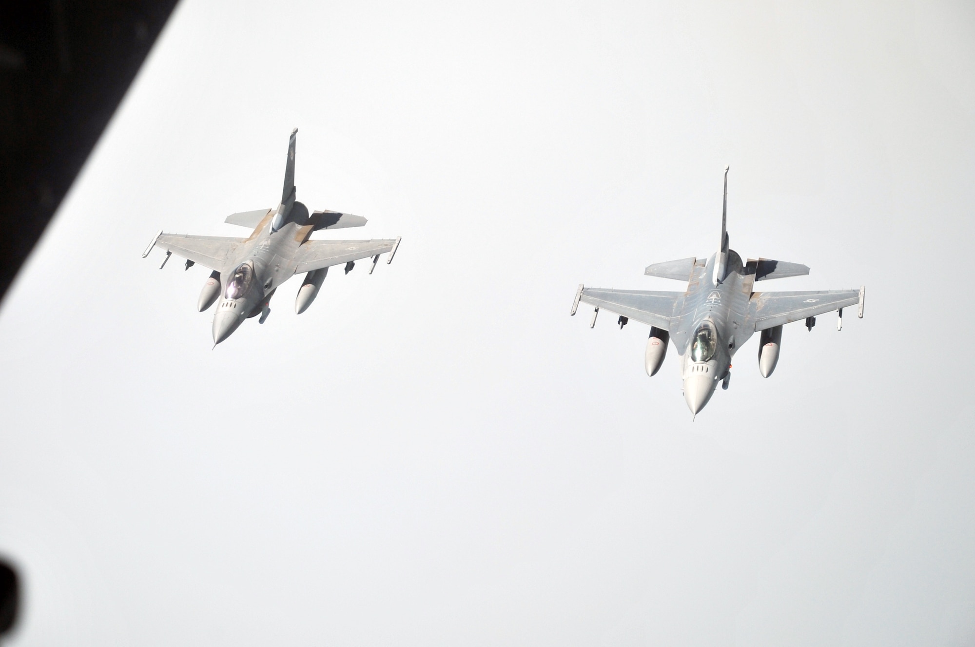 Two U.S. Air Force F-16 Fighting Falcons fly in formation as they take turns to be refueled by a KC-10 Extender from the 908th Expeditionary Air Refueling Squadron during an air refueling mission in the U.S. Central Command area of responsibility on April 24, 2010. In the first three months of 2010, Airmen supporting the KC-10 deployed air refueling in the U.S. Central Command area of responsibility flew more than 1,000 sorties offl-loading more than 108 million pounds of fuel to more than 6,600 aircraft in support of combat operations. The 908th EARS, as part of the 380th Air Expeditionary Wing, supports operations Iraqi Freedom and Enduring Freedom and the Combined Joint Task Force-Horn of Africa. (U.S. Air Force Photo/Master Sgt. Scott T. Sturkol/Released)
