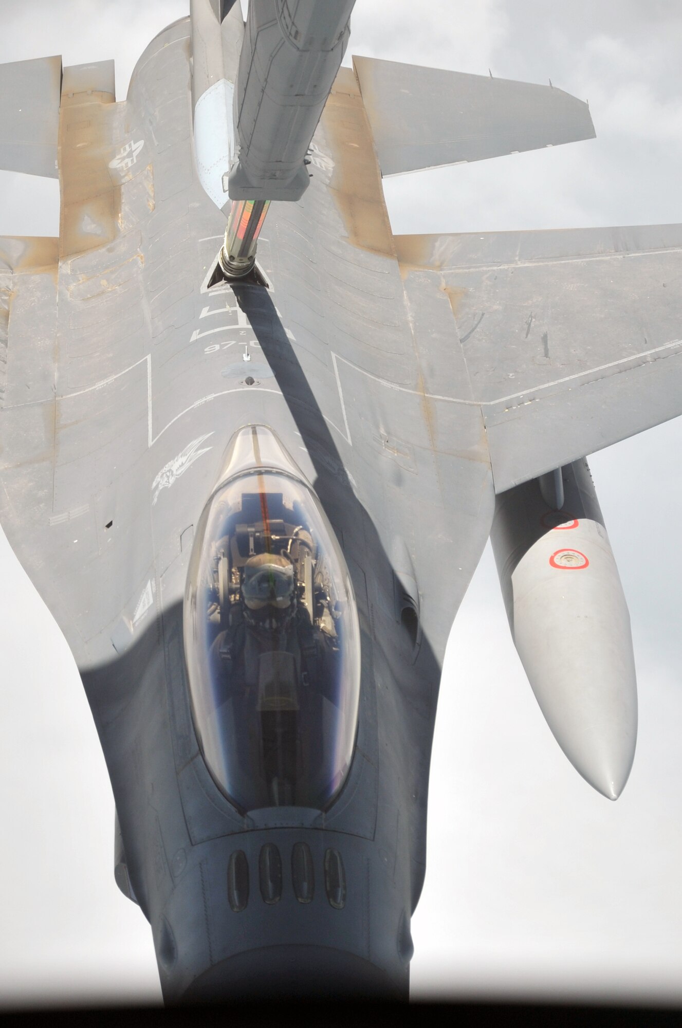 A U.S. Air Force F-16 Fighting Falcon is refueled by a KC-10 Extender from the 908th Expeditionary Air Refueling Squadron during an air refueling mission in the U.S. Central Command area of responsibility on April 24, 2010. In the first three months of 2010, Airmen supporting the KC-10 deployed air refueling in the U.S. Central Command area of responsibility flew more than 1,000 sorties offl-loading more than 108 million pounds of fuel to more than 6,600 aircraft in support of combat operations. The 908th EARS, as part of the 380th Air Expeditionary Wing, supports operations Iraqi Freedom and Enduring Freedom and the Combined Joint Task Force-Horn of Africa. (U.S. Air Force Photo/Master Sgt. Scott T. Sturkol/Released)