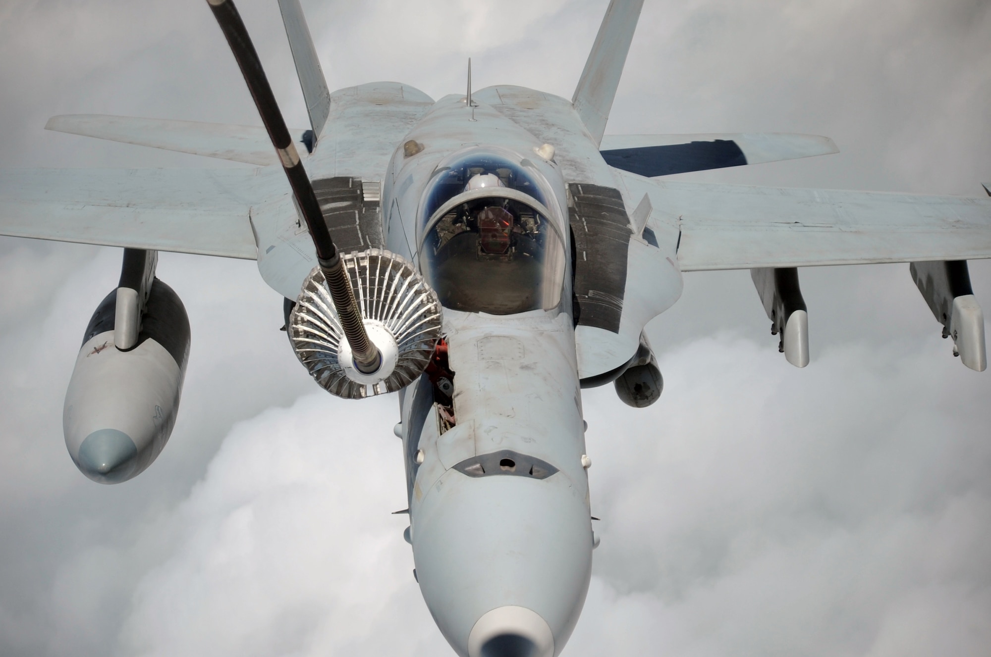 A U.S. Navy F-18 is refueled by a KC-10 Extender from the 908th Expeditionary Air Refueling Squadron during an air refueling mission in the U.S. Central Command area of responsibility on April 24, 2010. In the first three months of 2010, Airmen supporting the KC-10 deployed air refueling in the U.S. Central Command area of responsibility flew more than 1,000 sorties offl-loading more than 108 million pounds of fuel to more than 6,600 aircraft in support of combat operations. The 908th EARS, as part of the 380th Air Expeditionary Wing, supports operations Iraqi Freedom and Enduring Freedom and the Combined Joint Task Force-Horn of Africa. (U.S. Air Force Photo/Master Sgt. Scott T. Sturkol/Released)