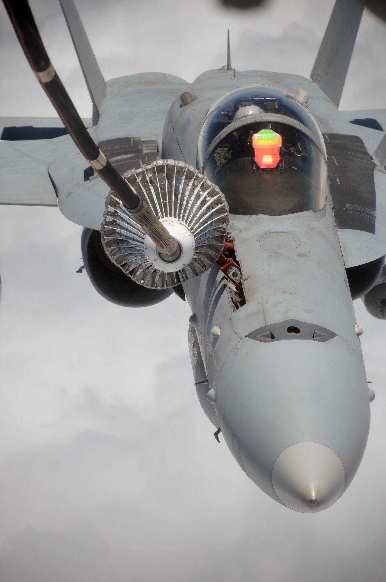 A U.S. Navy F-18 is shown flying in formation with a KC-10 Extender from the 908th Expeditionary Air Refueling Squadron during an air refueling mission in the U.S. Central Command area of responsibility on April 24, 2010. In the first three months of 2010, Airmen supporting the KC-10 deployed air refueling in the U.S. Central Command area of responsibility flew more than 1,000 sorties offl-loading more than 108 million pounds of fuel to more than 6,600 aircraft in support of combat operations. The 908th EARS, as part of the 380th Air Expeditionary Wing, supports operations Iraqi Freedom and Enduring Freedom and the Combined Joint Task Force-Horn of Africa. (U.S. Air Force Photo/Master Sgt. Scott T. Sturkol/Released)