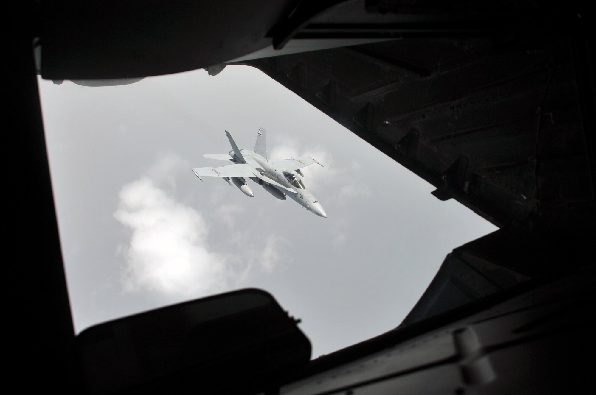 A U.S. Navy F-18 is refueled by a KC-10 Extender from the 908th Expeditionary Air Refueling Squadron during an air refueling mission in the U.S. Central Command area of responsibility on April 24, 2010. In the first three months of 2010, Airmen supporting the KC-10 deployed air refueling in the U.S. Central Command area of responsibility flew more than 1,000 sorties offl-loading more than 108 million pounds of fuel to more than 6,600 aircraft in support of combat operations. The 908th EARS, as part of the 380th Air Expeditionary Wing, supports operations Iraqi Freedom and Enduring Freedom and the Combined Joint Task Force-Horn of Africa. (U.S. Air Force Photo/Master Sgt. Scott T. Sturkol/Released)