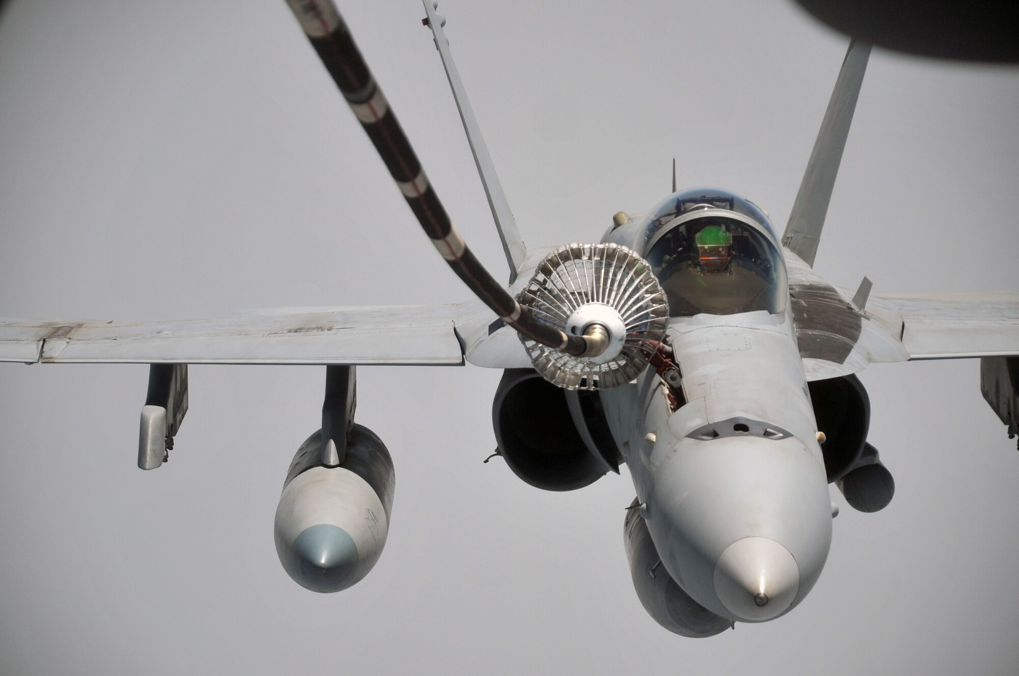 A U.S. Navy F-18 is refueled by a KC-10 Extender from the 908th Expeditionary Air Refueling Squadron during an air refueling mission in the U.S. Central Command area of responsibility on April 24, 2010. In the first three months of 2010, Airmen supporting the KC-10 deployed air refueling in the U.S. Central Command area of responsibility flew more than 1,000 sorties offl-loading more than 108 million pounds of fuel to more than 6,600 aircraft in support of combat operations. The 908th EARS, as part of the 380th Air Expeditionary Wing, supports operations Iraqi Freedom and Enduring Freedom and the Combined Joint Task Force-Horn of Africa. (U.S. Air Force Photo/Master Sgt. Scott T. Sturkol/Released)