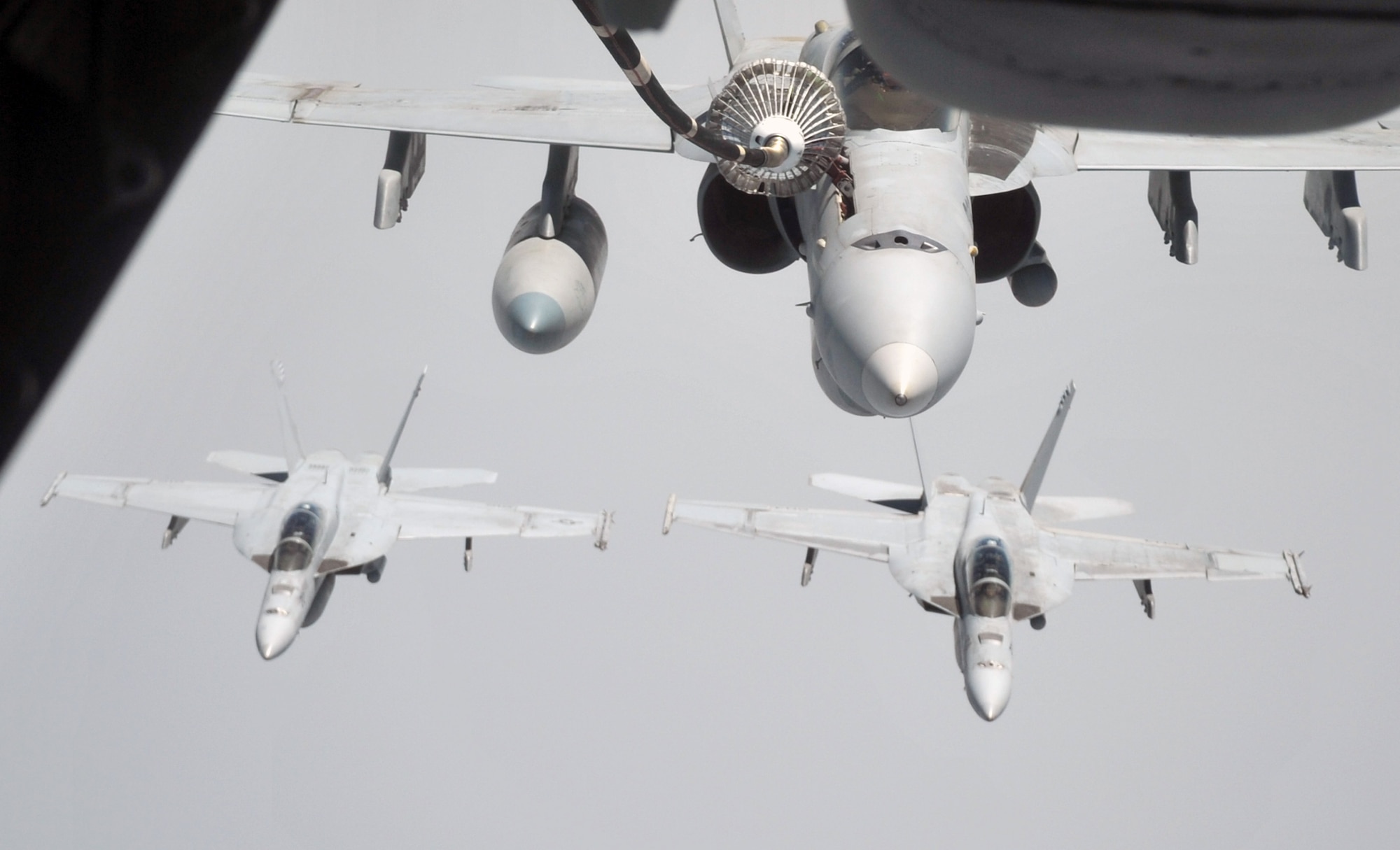 A U.S. Navy F-18 is refueled by a KC-10 Extender from the 908th Expeditionary Air Refueling Squadron during an air refueling mission in the U.S. Central Command area of responsibility on April 24, 2010. In the first three months of 2010, Airmen supporting the KC-10 deployed air refueling in the U.S. Central Command area of responsibility flew more than 1,000 sorties offl-loading more than 108 million pounds of fuel to more than 6,600 aircraft in support of combat operations. The 908th EARS, as part of the 380th Air Expeditionary Wing, supports operations Iraqi Freedom and Enduring Freedom and the Combined Joint Task Force-Horn of Africa. (U.S. Air Force Photo/Master Sgt. Scott T. Sturkol/Released)