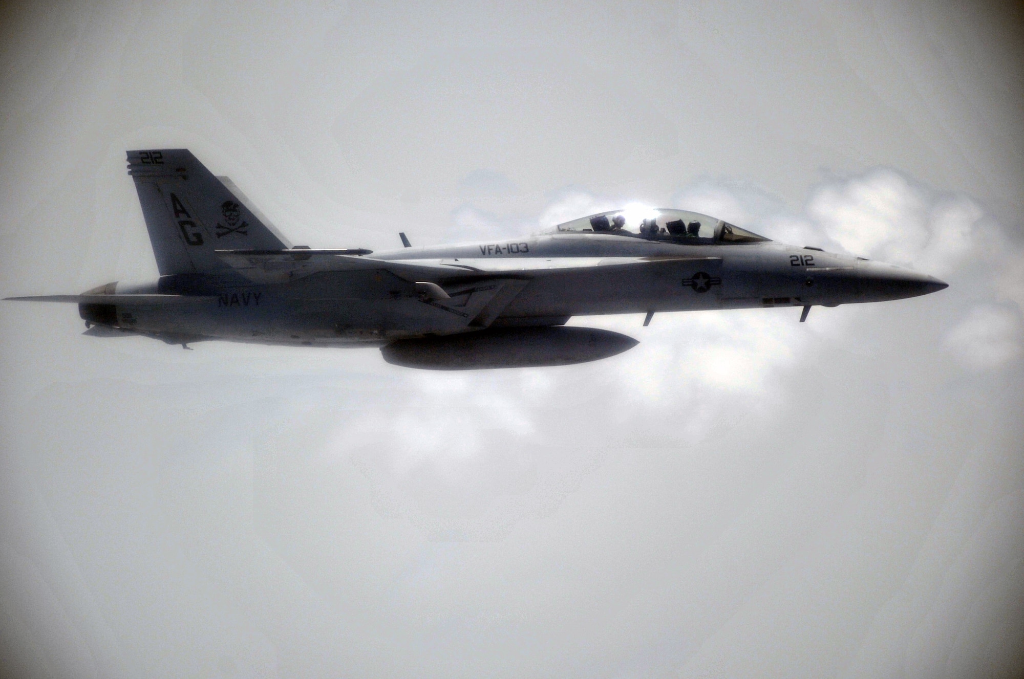 A U.S. Navy F-18 flies in formation with a KC-10 Extender from the 908th Expeditionary Air Refueling Squadron prior to it being refueled during an air refueling mission in the U.S. Central Command area of responsibility on April 24, 2010. In the first three months of 2010, Airmen supporting the KC-10 deployed air refueling in the U.S. Central Command area of responsibility flew more than 1,000 sorties offl-loading more than 108 million pounds of fuel to more than 6,600 aircraft in support of combat operations. The 908th EARS, as part of the 380th Air Expeditionary Wing, supports operations Iraqi Freedom and Enduring Freedom and the Combined Joint Task Force-Horn of Africa. (U.S. Air Force Photo/Master Sgt. Scott T. Sturkol/Released)