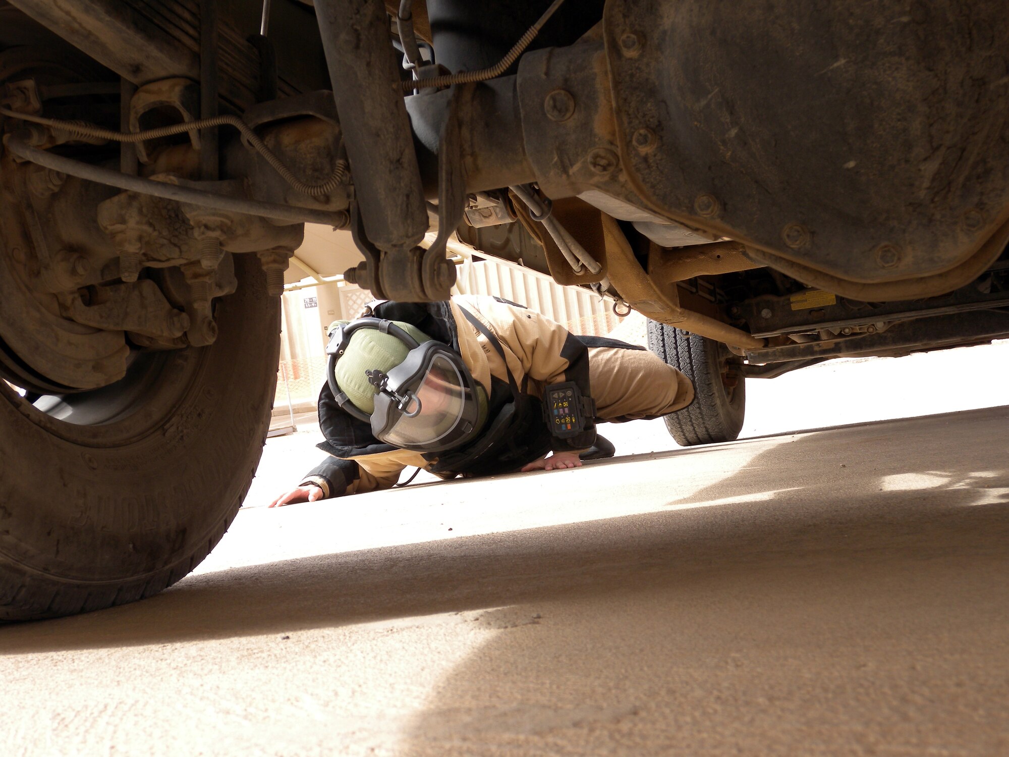 Staff Sgt. Mason Messick, 64th Expeditionary Support Squadron Explosive Ordnance Team leader, inspects a vehicle during a training exercise at a non-disclosed Southwest Asia location April 22, 2010.[RELEASED]