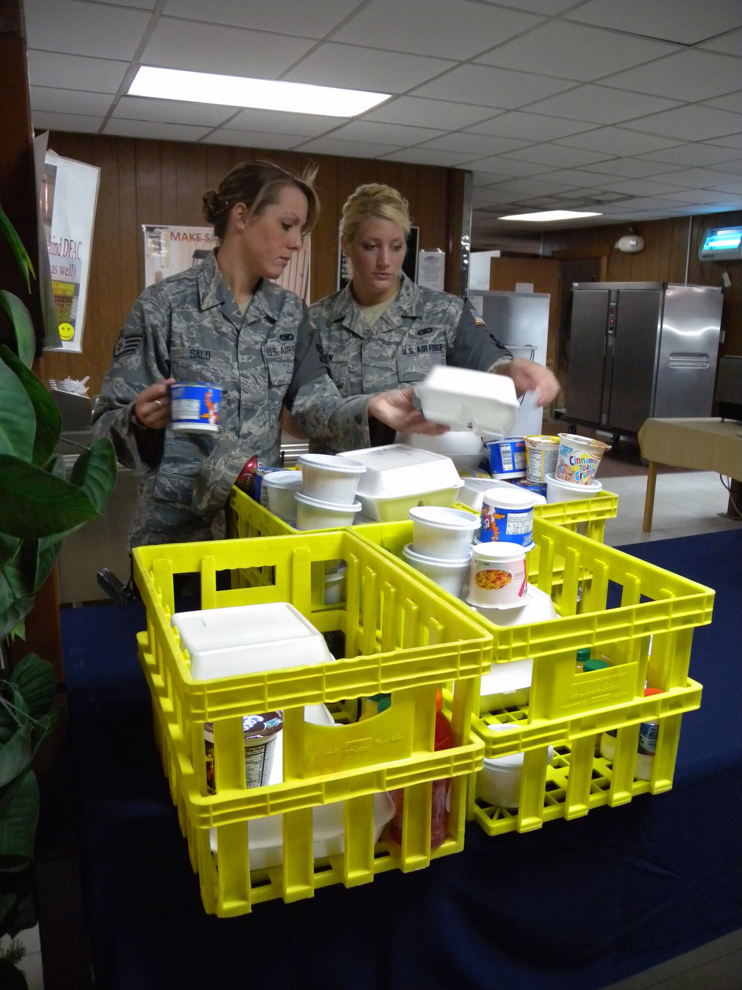 Staff Sgt. Jessica Salo and Senior Airman Meghan Boben, 64th Expeditionary Security Forces Squadron members, execute a "chow run" for fellow ESFS members April 22, 2010, at a non-disclosed Southwest Asia location.[RELEASED]