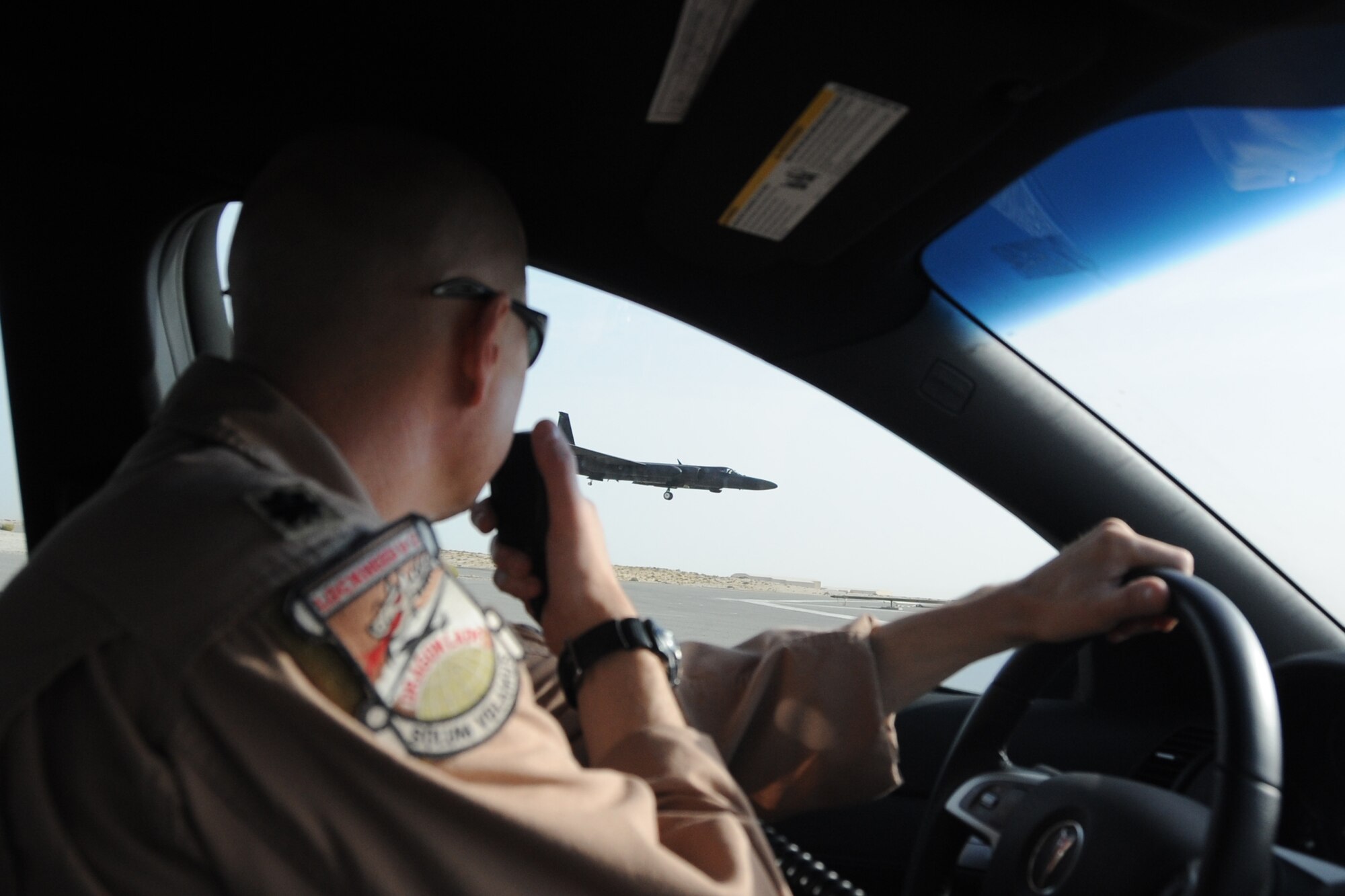 Lt. Col. Kirt Stallings, 99th Expeditionary Reconnaissance Squadron commander, drives the chase car, which gives visual assistance to U-2 Dragon Lady pilots,  as Col. Soren Jones, 380th Expeditionary Operations Group commander, lands a  U-2 Dragon Lady an undisclosed location in Southwest Asia on April 30, 2010. The 380th Air Expeditionary Wing, supports Operations Iraqi Freedom and Enduring Freedom and the Combined Joint Task Force-Horn of Africa. The 380th AEW is comprised of four groups and 12 squadrons and the wing's deployed mission includes air refueling, surveillance and reconnaissance in support of overseas contingency operations in Southwest Asia. (U.S. Air Force photo/Senior Airman Jenifer H. Calhoun/Released)
