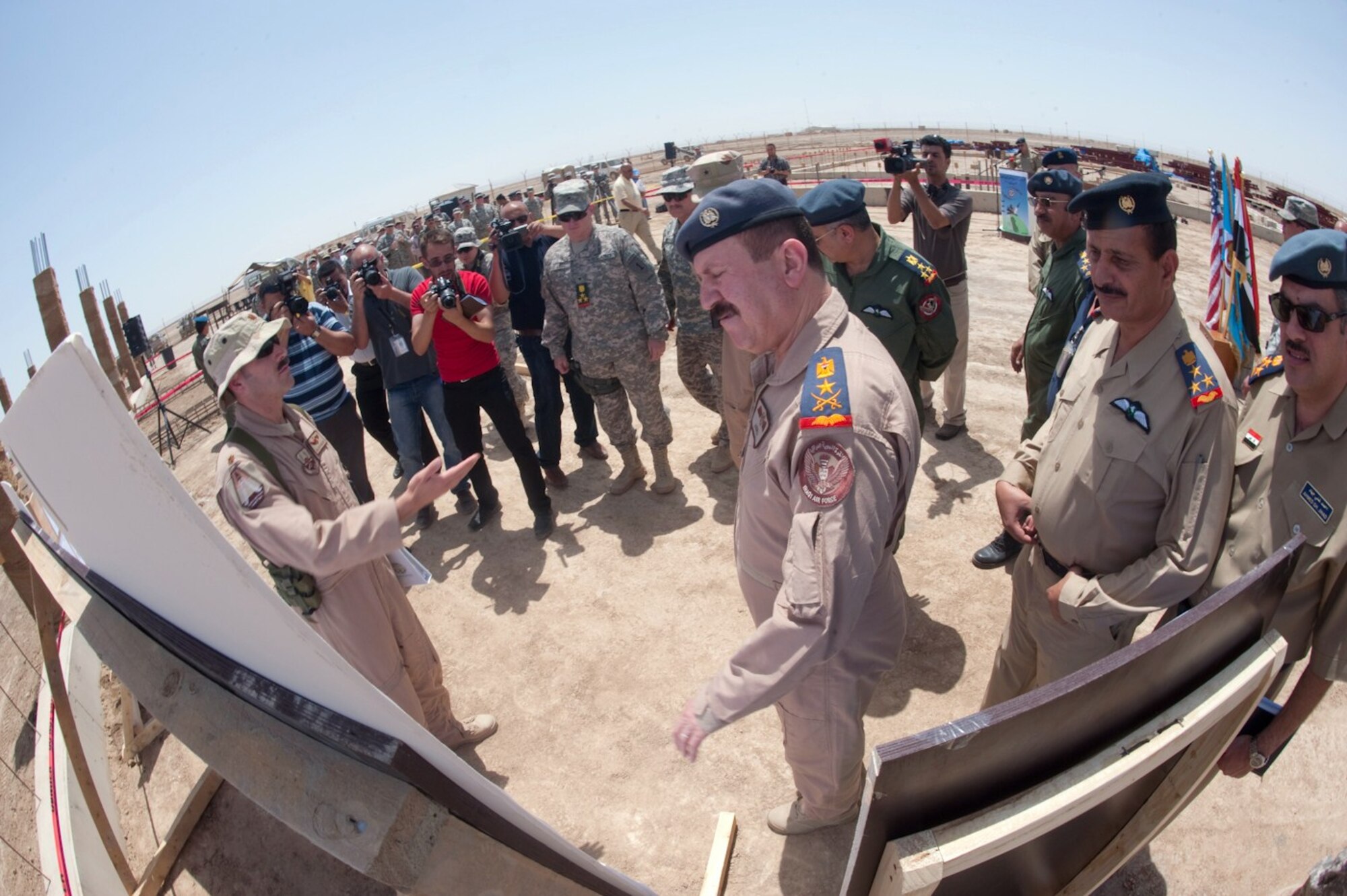 Iraq Air Force commander Staff Lt. Gen. Anwar receives a construction briefing at the Section Operations Center (SOC) dedication ceremony at Ali Base, Iraq April 27, 2010.  The SOC will help provide long-range radar sight capability throughout southern Iraq. (U.S. Air Force photo by Senior Master Sgt. Elizabeth Gilbert/released)