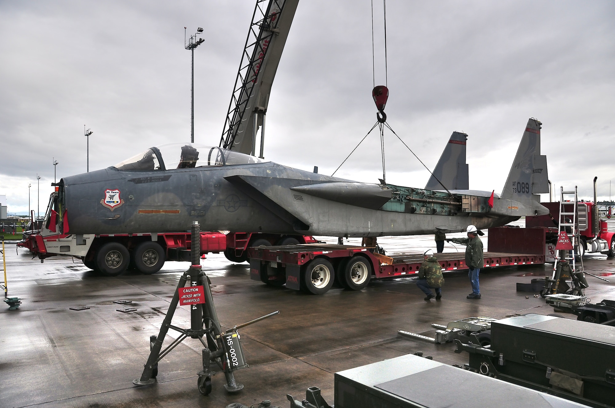 A 1973 A-model F15 the oldest in the Air Force inventory, gets loaded onto a trailer to be transported to the Evergreen Aviation Museum in McMinnville Oregon on April 29th 2010 at the Portland Air National Guard base, Portland Oregon. It will then be reassembled there and put on display. (Photo by Tech Sergeant Dave Huber USAF)