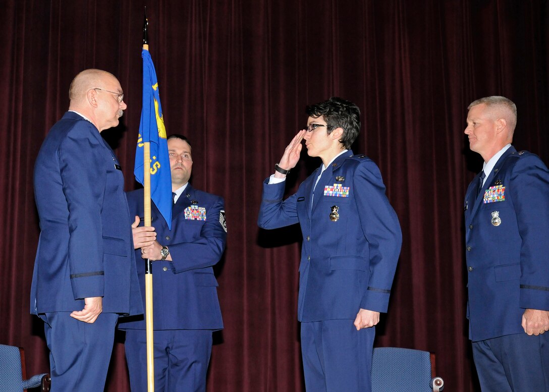 Capt Kelly Neuenfeldt salutes the 141st Mission Support Group Commander, Col Michael Hirst, as she assumes command of the 141st Security Forces Flight. (U.S. Air Force photo by Staff Sgt. Anthony Ennamorato/Released)