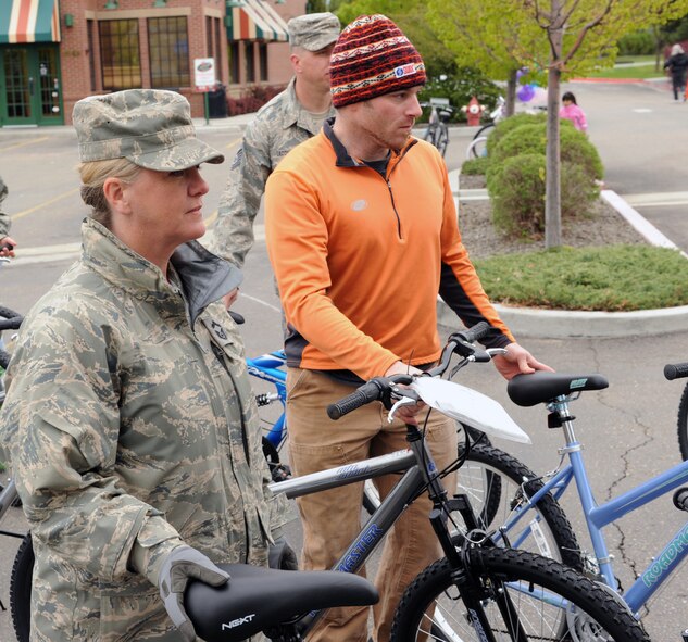 Senior Master Sgt.Becky Coles of the 124th Fighter Wing Gowen Field Boise, Idaho prepares to transport unused bikes donated for Bikes for Burgers May 1, 2010.  This will be the eighteenth year members of the Idaho Air National Guard have participated in this community activity to provide bikes for under privileged kids (U.S. Air Force Photo by Staff Sergeant Heather Walsh, RELEASED). 
