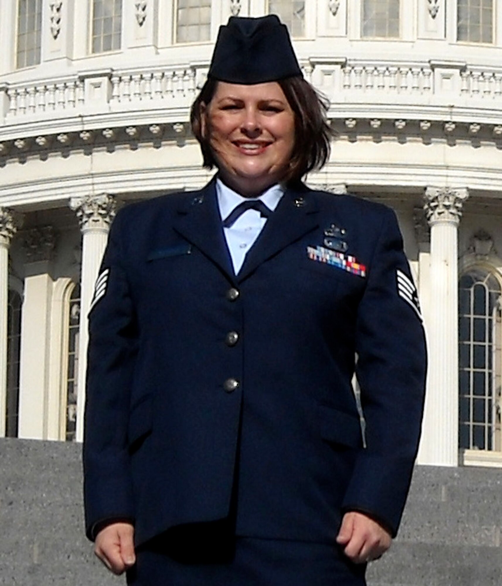 JOINT BASE LEWIS-MCCHORD, Wash. -- Staff Sgt. Terri Schmidt, a Reservist with the 728th Airlift Squadron here, pauses in front of the capitol building in Washington D.C., during a recent Congressional tour.  After winning at the Air Force Reserve Command level, Sergeant Schmidt is the Air Reserve Component. Aviation Resource Management NCO of the Year at the Air Force level.  "Terri makes the whole squadron better," said Lt. Col. Colin Carr, 728th AS commander. "Her potential is limitless." (Courtesy photo)