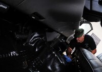 Tech. Sgt. Norman Hall, 919th Aircraft Maintenance Squadron, wipes down the interior of a bobtail truck May 1 at Duke Field.  Members of the squadron brought over regularly used vehicles to the wash rack for a much-needed cleaning.  (U.S. Air Force photo/Tech. Sgt. Samuel King Jr.)