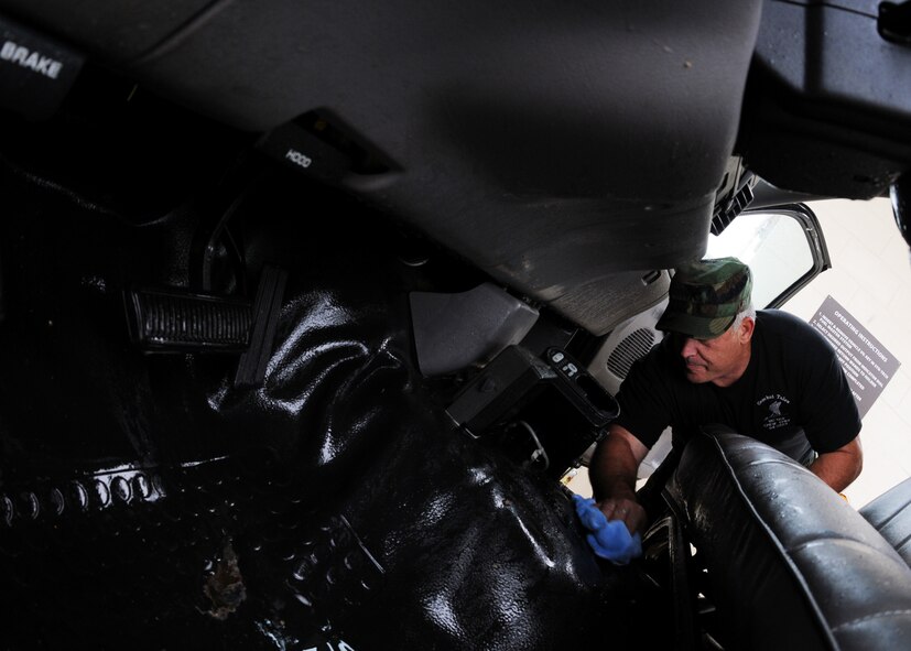 Tech. Sgt. Norman Hall, 919th Aircraft Maintenance Squadron, wipes down the interior of a bobtail truck May 1 at Duke Field.  Members of the squadron brought over regularly used vehicles to the wash rack for a much-needed cleaning.  (U.S. Air Force photo/Tech. Sgt. Samuel King Jr.)