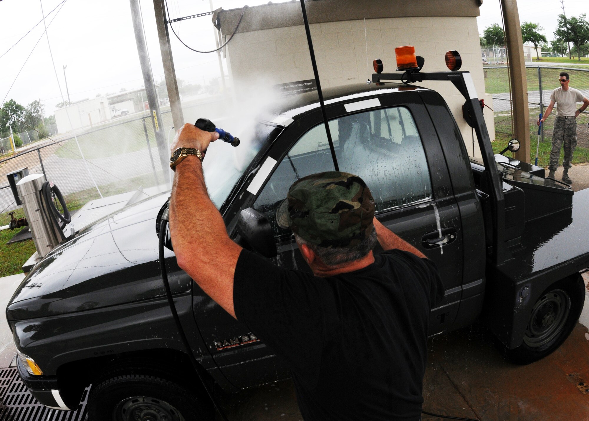 Tech. Sgt. Norman Hall, 919th Aircraft Maintenance Squadron, sprays down a bobtail truck May 1 at Duke Field.  Members of the squadron brought over regularly used vehicles to the wash rack for a much-needed cleaning.  (U.S. Air Force photo/Tech. Sgt. Samuel King Jr.)